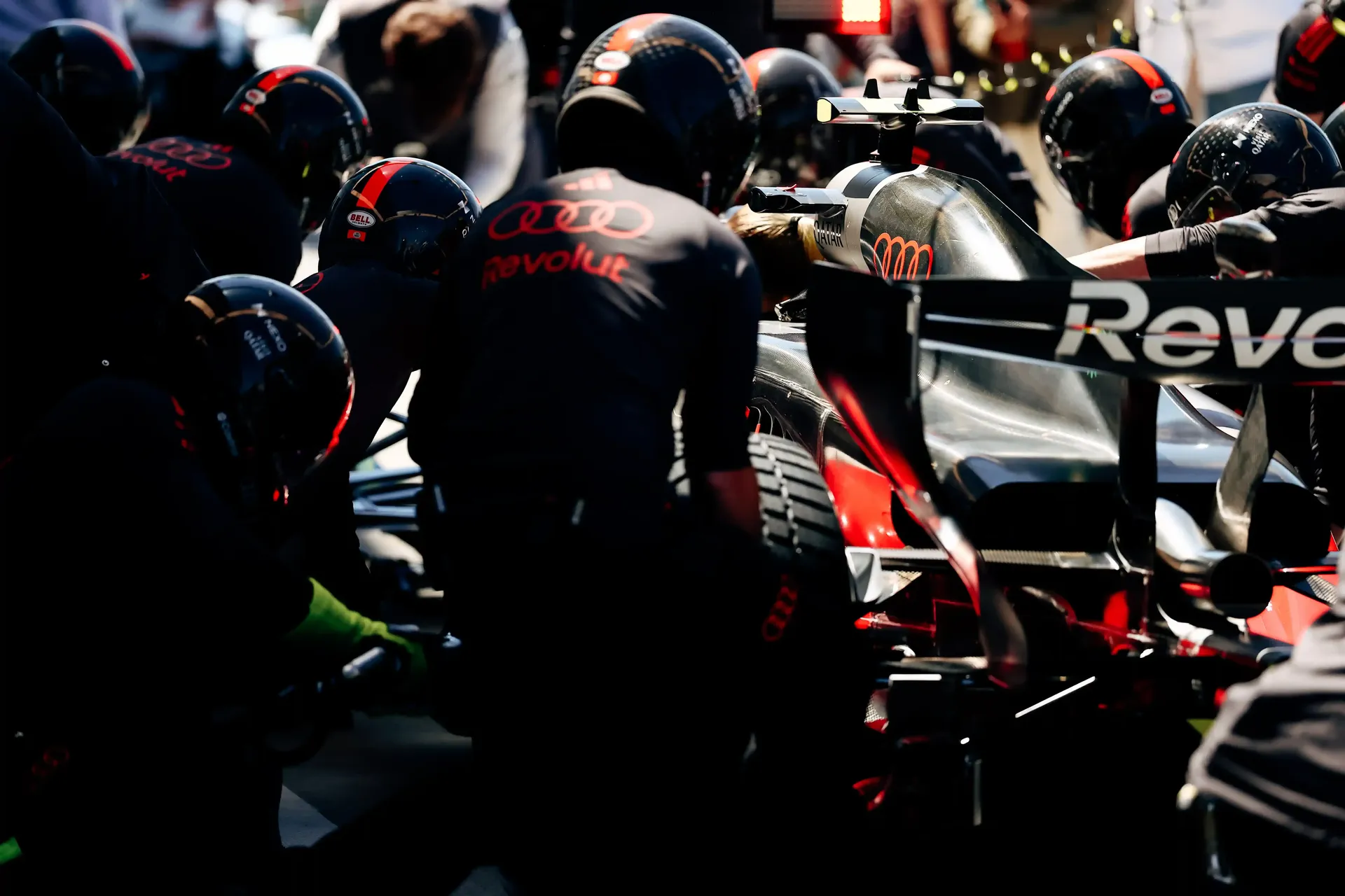Audi Revolut F1® Team car R26 surrounded by crew members and mechanics during a pit stop action at the canadian Grand Prix 2026