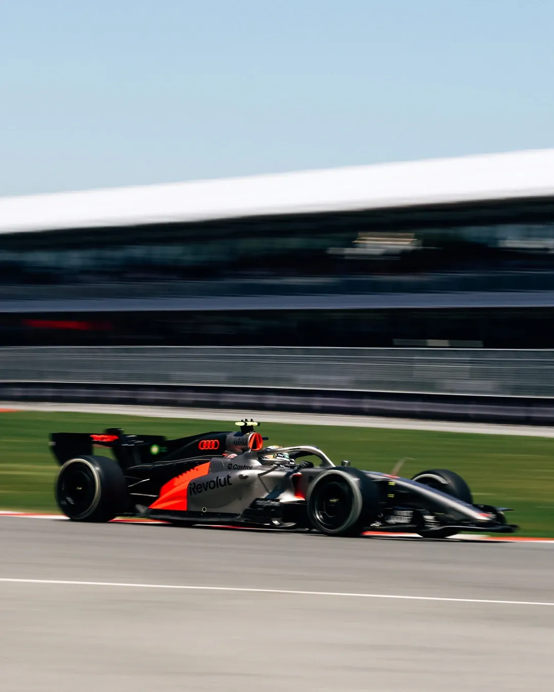 Side view of the Audi Revolut F1® Team car R26 passing by at the Canadian Grand Prix on Day one FP1