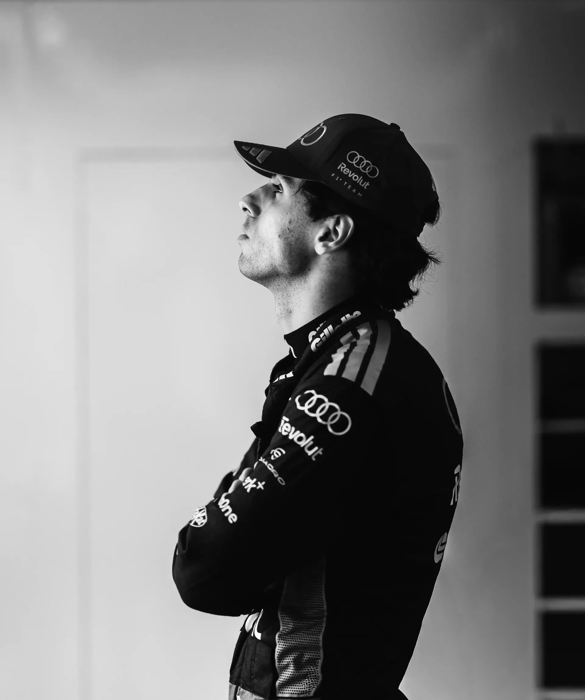 Black and WHite Side Portrait of Gabriel Bortoleto inside the Audi Revolut F1® Team garage at the Canada Grand Prix 2026