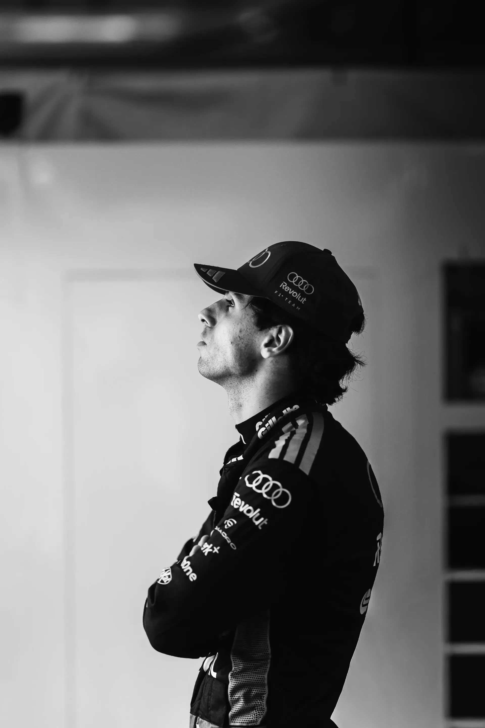 Black and WHite Side Portrait of Gabriel Bortoleto inside the Audi Revolut F1® Team garage at the Canada Grand Prix 2026