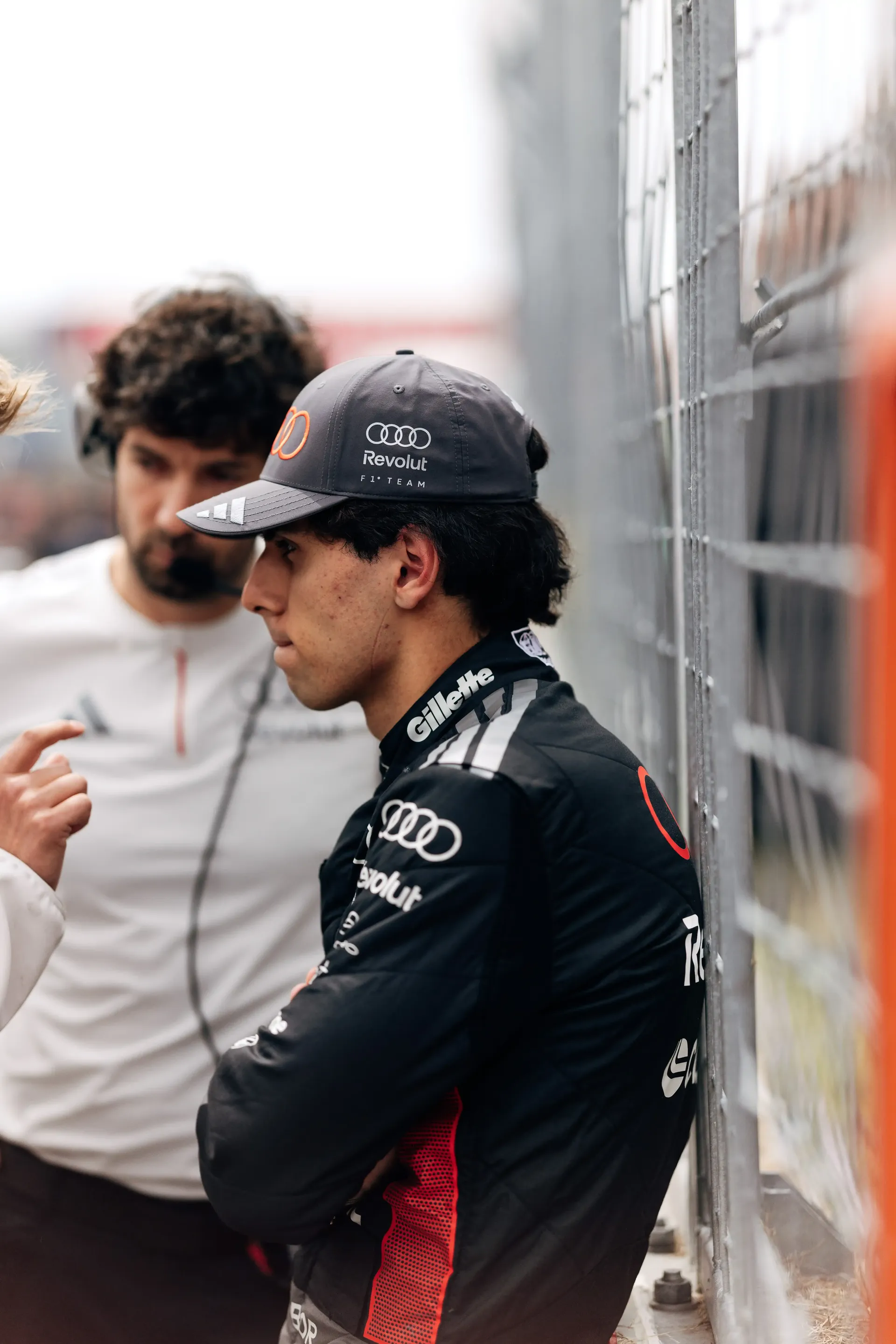 Side portrait of Gabriel Bortoleto driver at the Audi Revolut F1® Team standing at the side lane with team engineer at the Canada Grand Prix 2026
