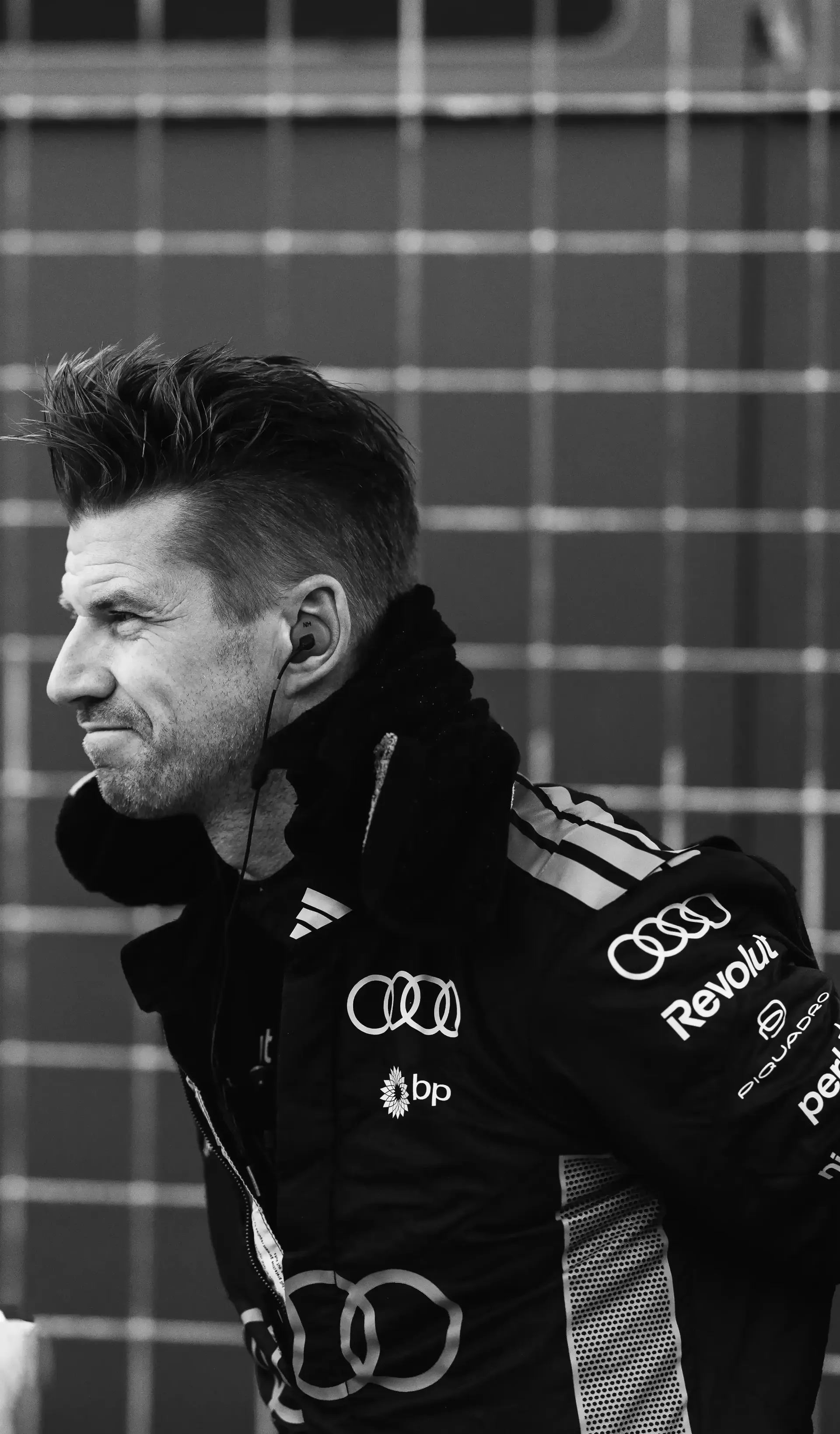 Black and White shot of Nicko Hulkneberg driver at the Audi Revolut F1® Team standing at the side lane of the Circuite Gilles VIllneuve at the Canada Grand Prix 2026