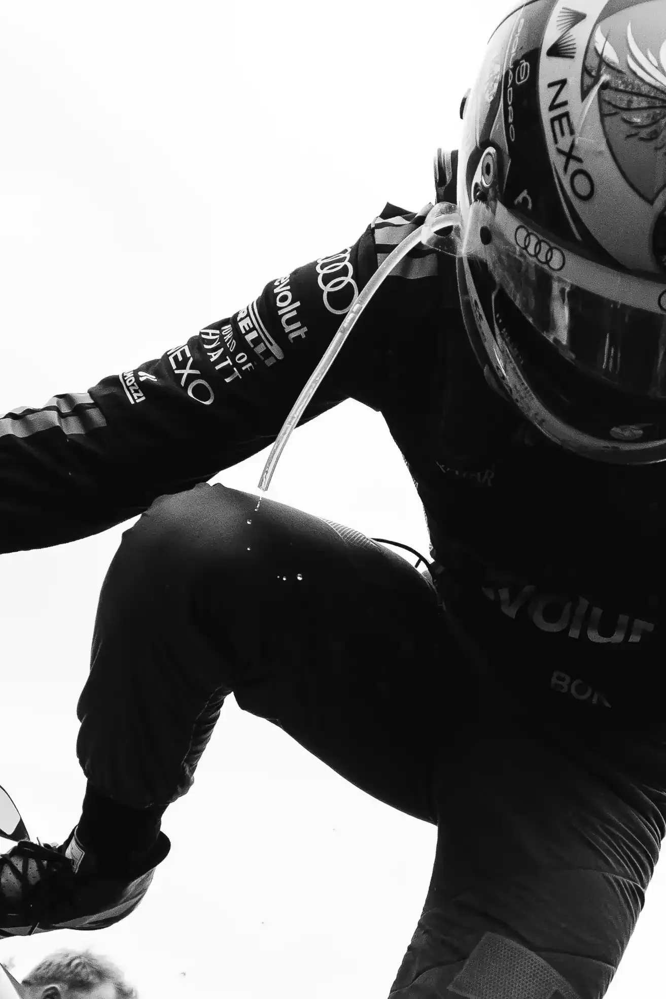 Black and white close up of Gabriel Bortoleto driver at the Audi Revolut F1® Team inside the garage at the Canada Grand Prix 2026