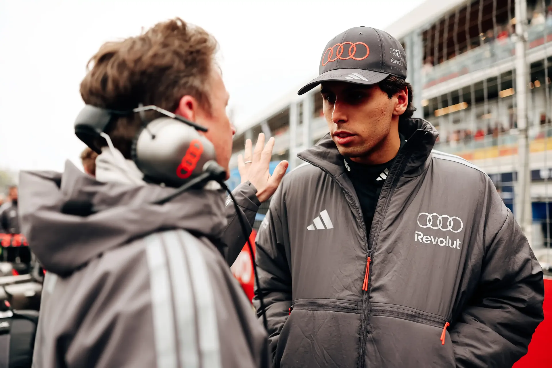 Gabriel Bortoleto driver at the Audi Revolut F1® Team talking to Allan McNish at the Canada Grand Prix 2026