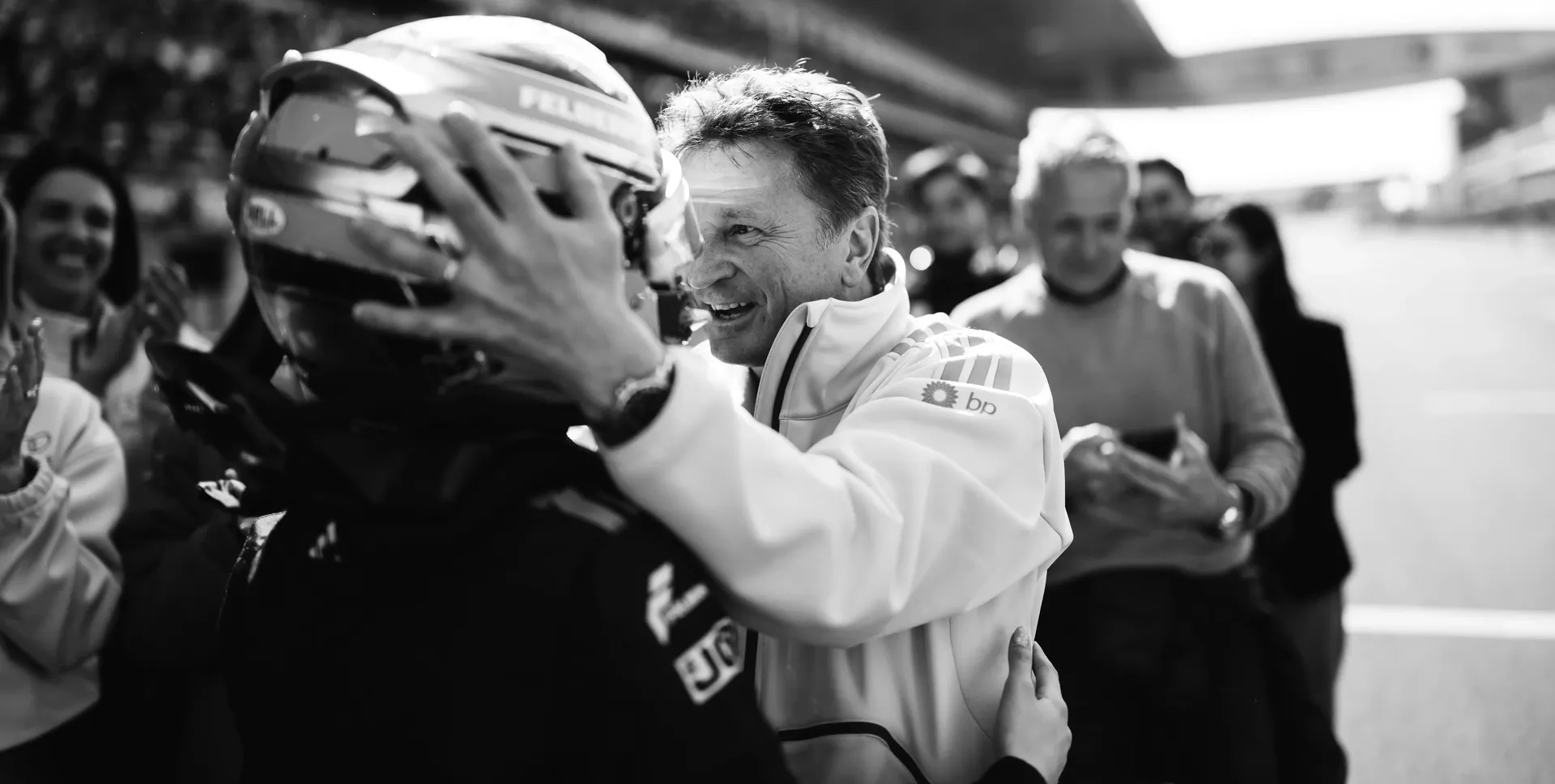 Allan McNish cheering and hugging driver Emma Felbermayr at the Audi Revolut F1® Team Academy car on the racetrack Chinese Grand Prix at Shanghai