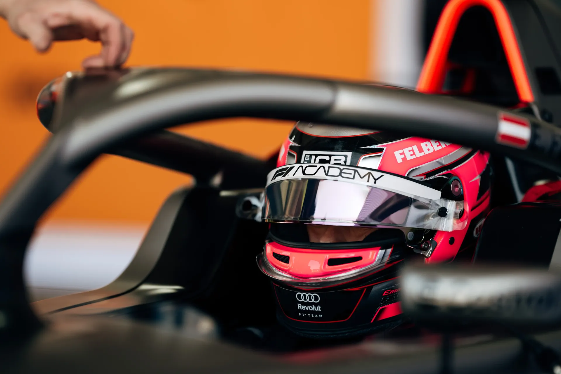 Emma Felbermayr, Audi Revolut F1® Team Academy driver, sitting in the cockpit with the halo and steering wheel visible.