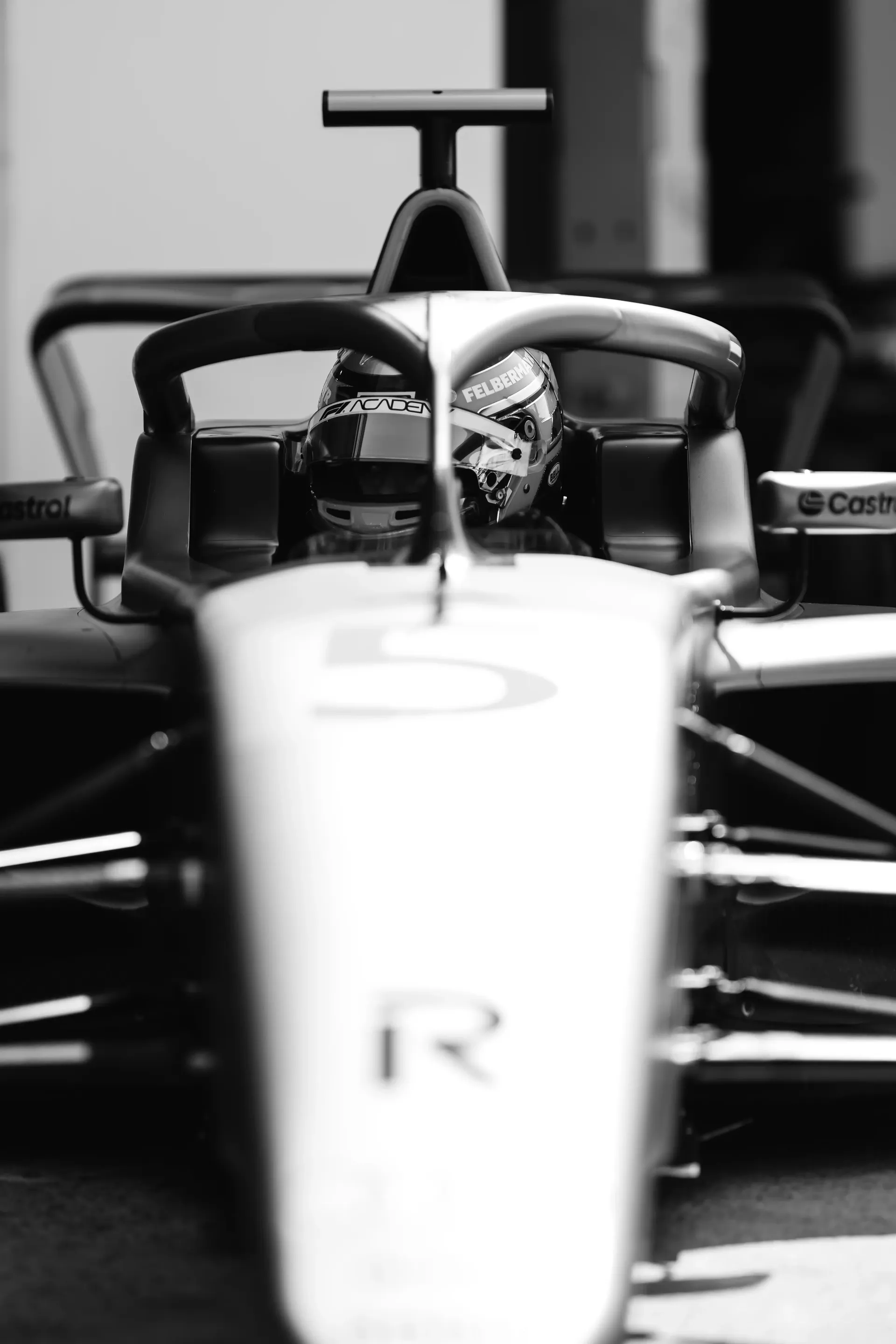 Front view of the Audi Revolut F1® Team Formula 1 car with Emma Felbermayr, Audi Revolut F1® Team Academy driver, seated in the cockpit.