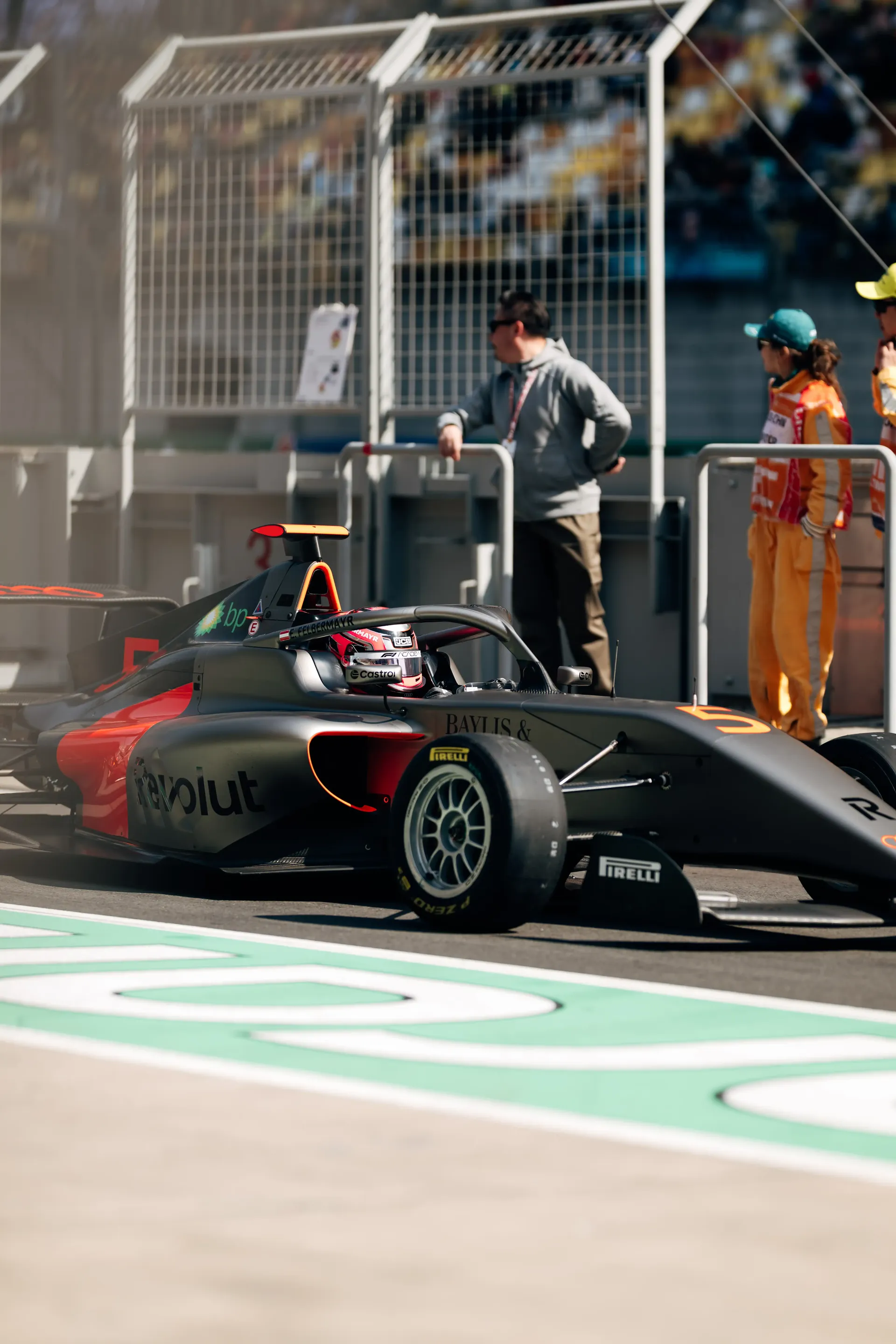 Audi Revolut F1® Team Formula 1 car exiting the garage with Emma Felbermayr, Audi Revolut F1® Team Academy driver, during a test session.