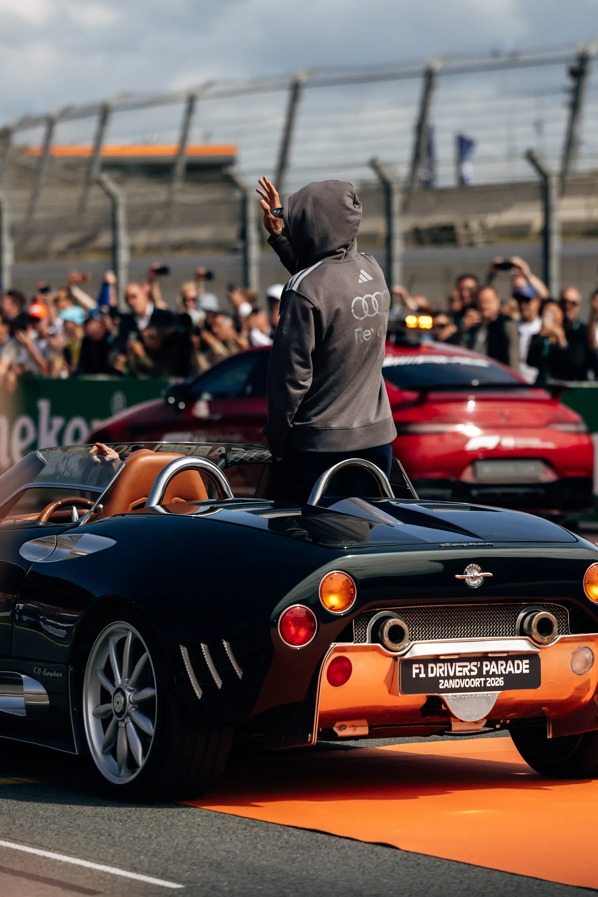Nico Hulkenberg waving to fans from an Audi Revolut F1® Team parade car during the Dutch Grand Prix.