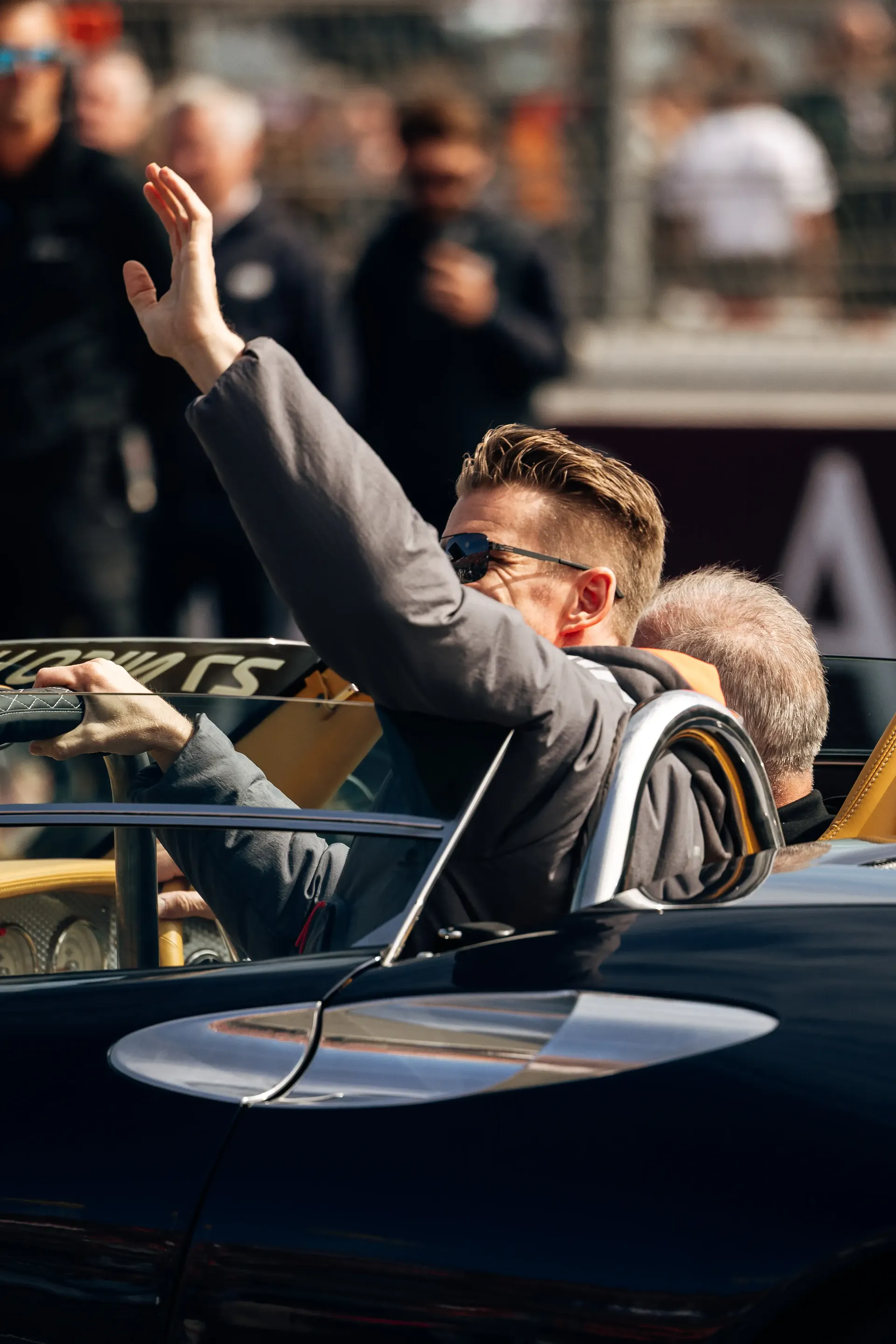 Nico Hulkenberg waving to the crowd from an Audi Revolut F1® Team parade car during the Dutch Grand Prix.
