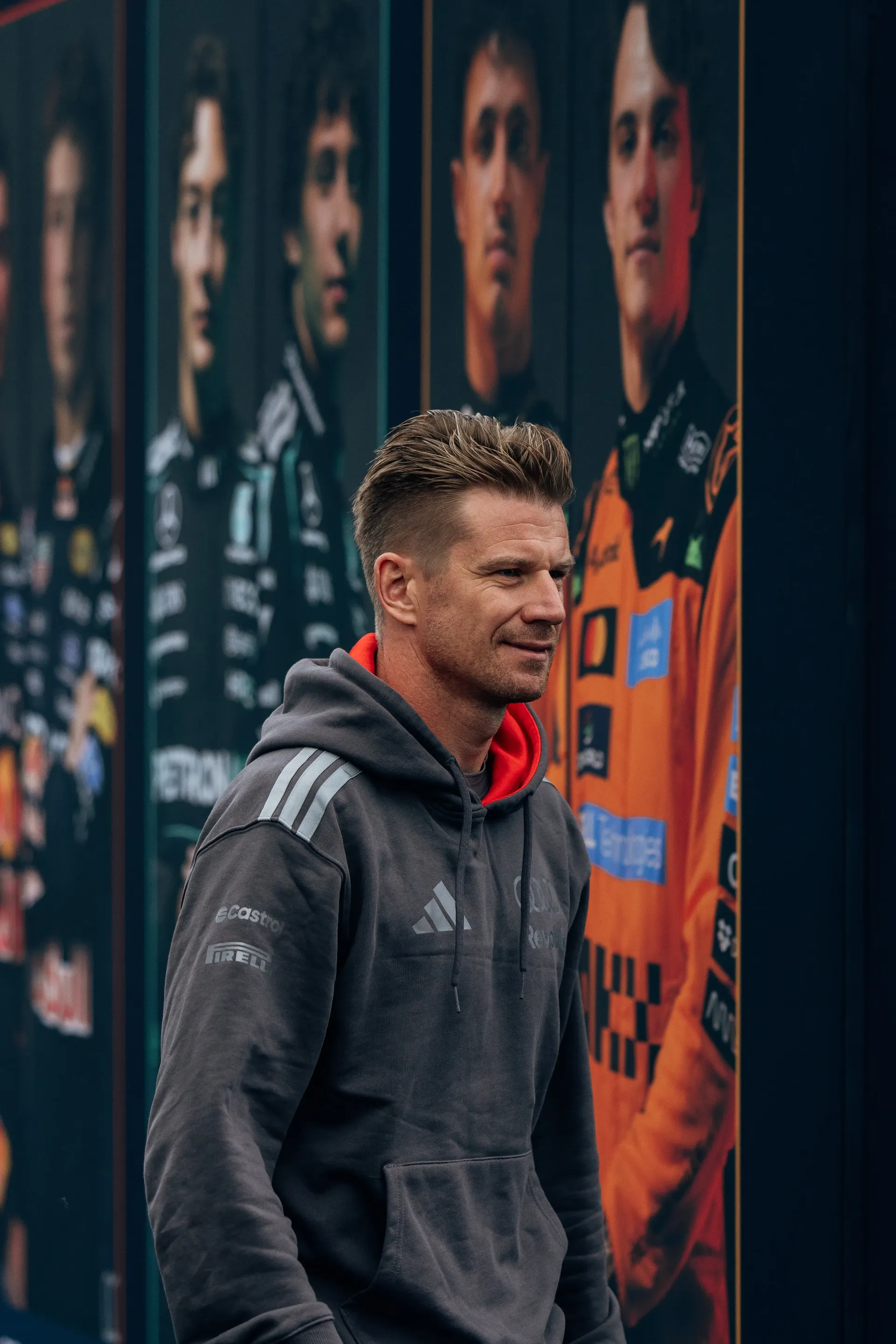 Audi Revolut F1® Team driver Nico Hulkenberg walking through the paddock.