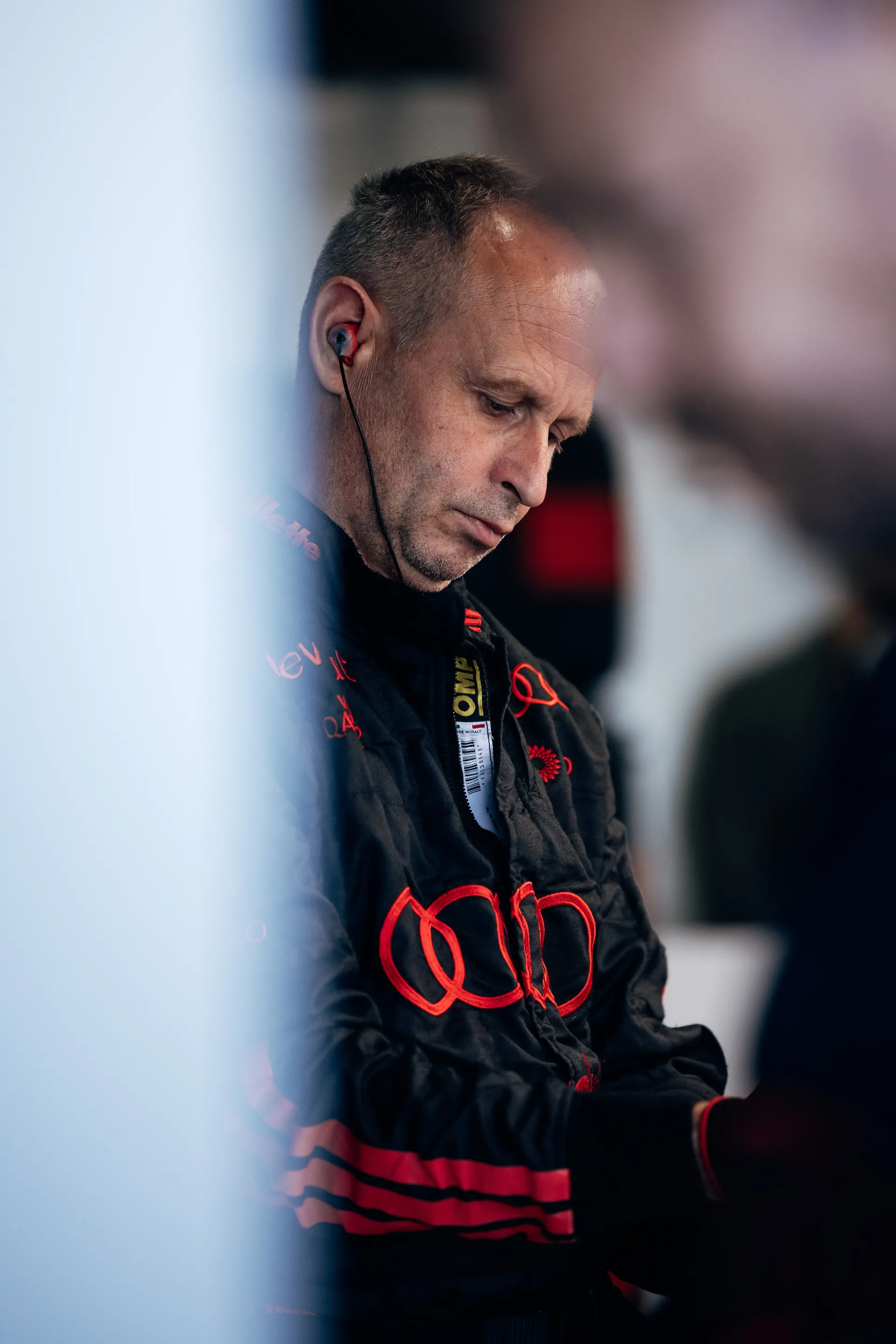 Audi Revolut F1® Team mechanic sitting inside the team garage.