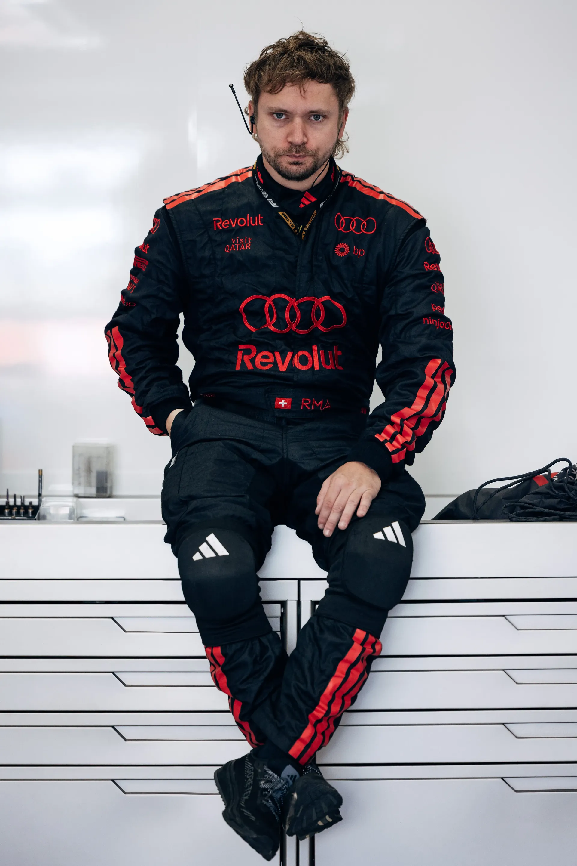 Audi Revolut F1® Team mechanic sitting inside the team garage.
