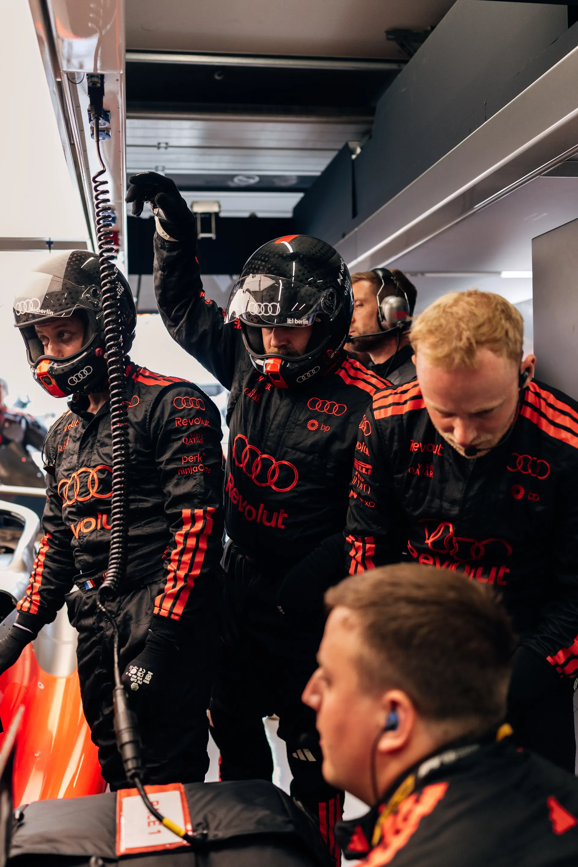 Audi Revolut F1® Team mechanics preparing the car inside the garage.