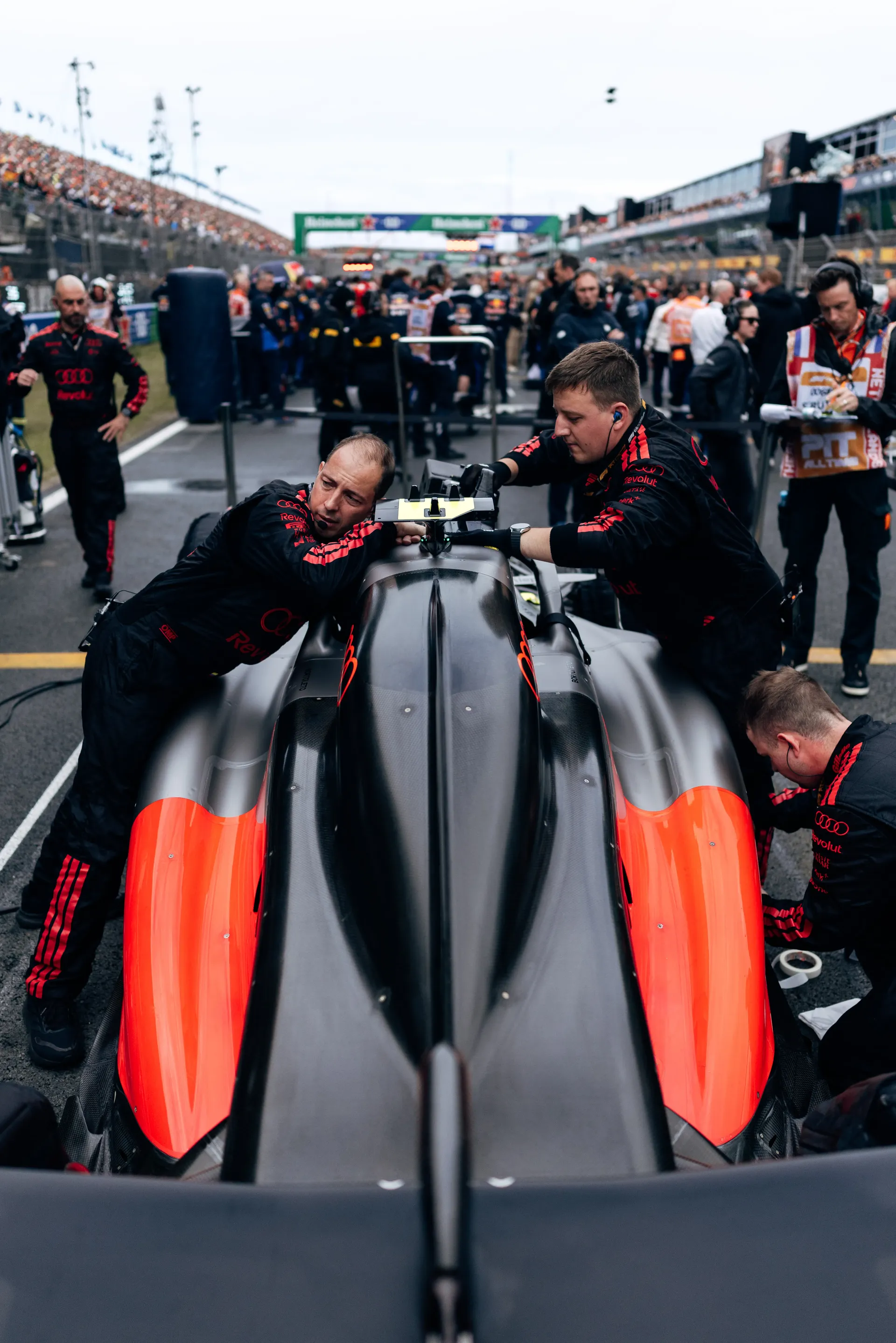 Audi Revolut F1® Team mechanics prepare the Audi R26 on the Dutch Grand Prix grid.