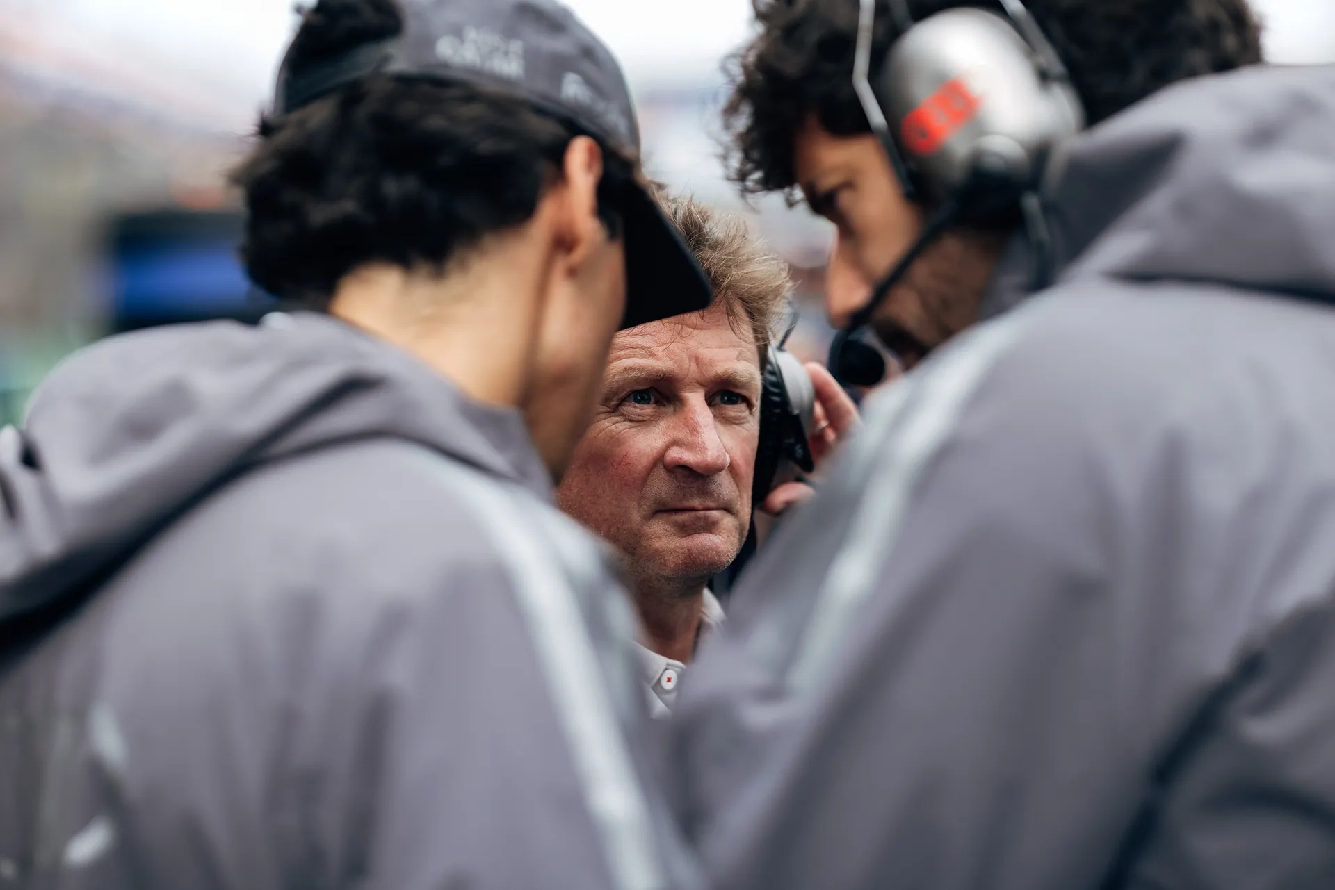 Audi Revolut F1® Team engineers gather around racing director allan McNish for a final discussion before the race.