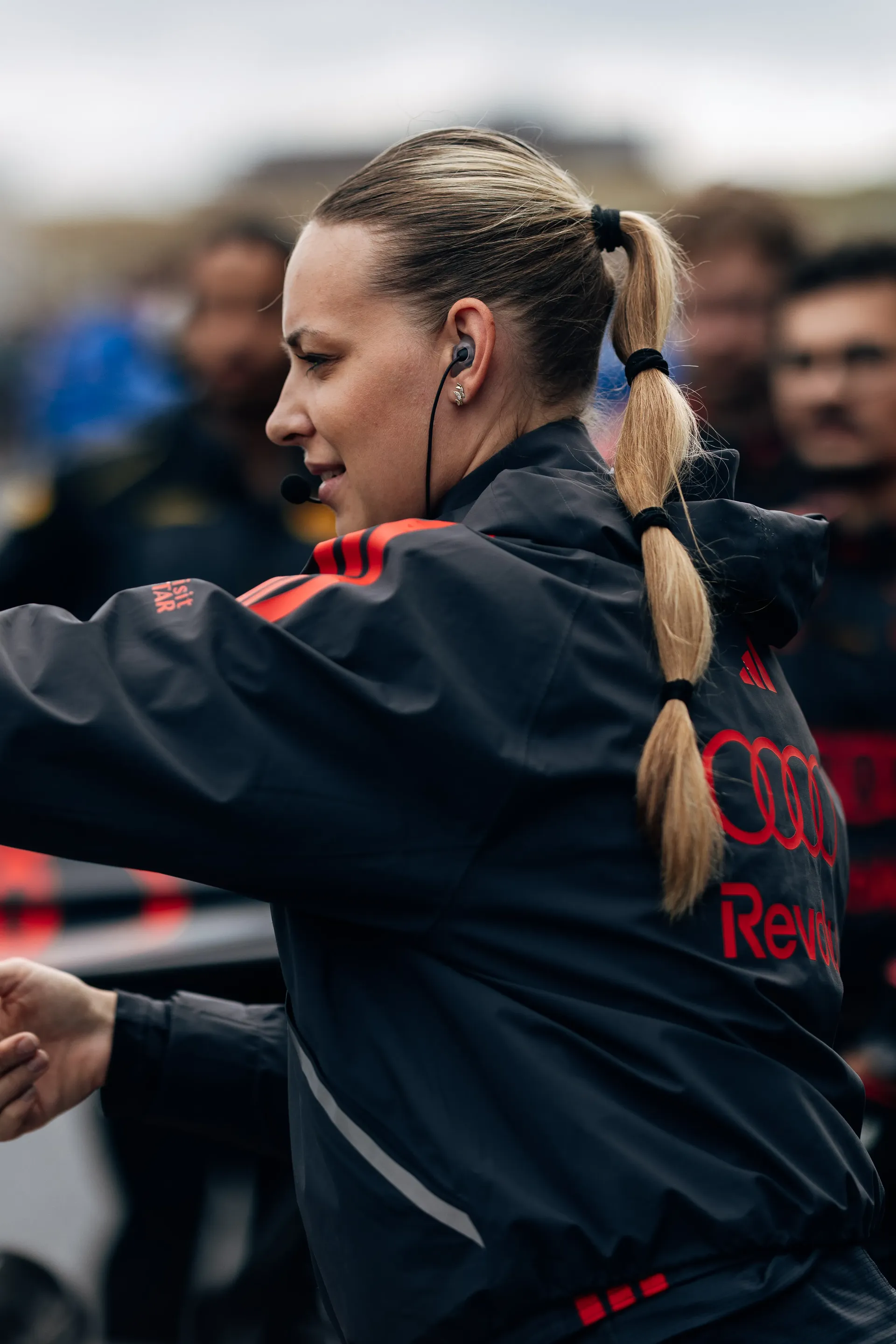 Audi Revolut F1® Team mechanic wearing a headset prepares on the Dutch Grand Prix grid.