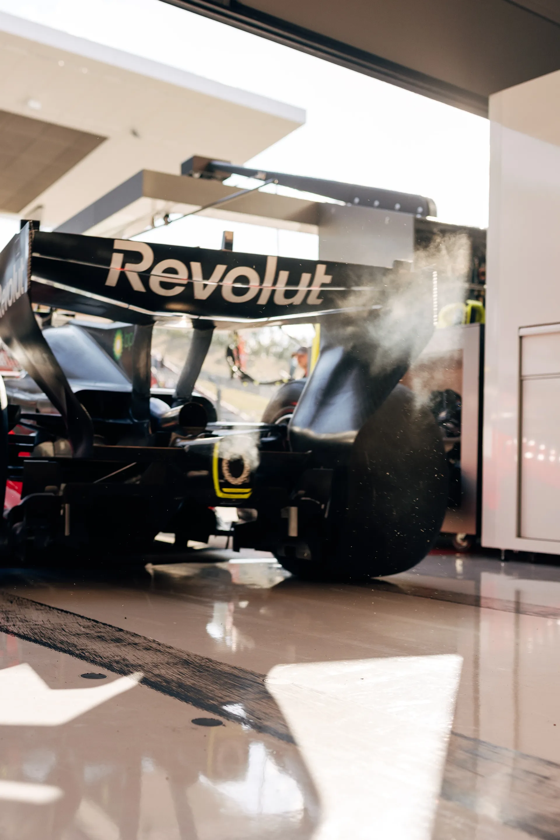 Rear view of the Audi Revolut F1® Team R26 Formula 1 car in the garage, with Revolut branding across the rear wing.