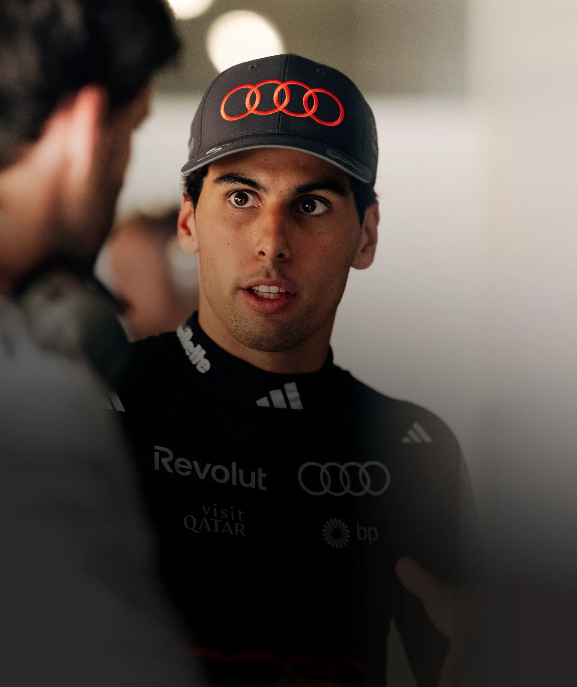 Gabriel Bortoleto of the Audi Revolut F1® Team in conversation in the garage in Madrid