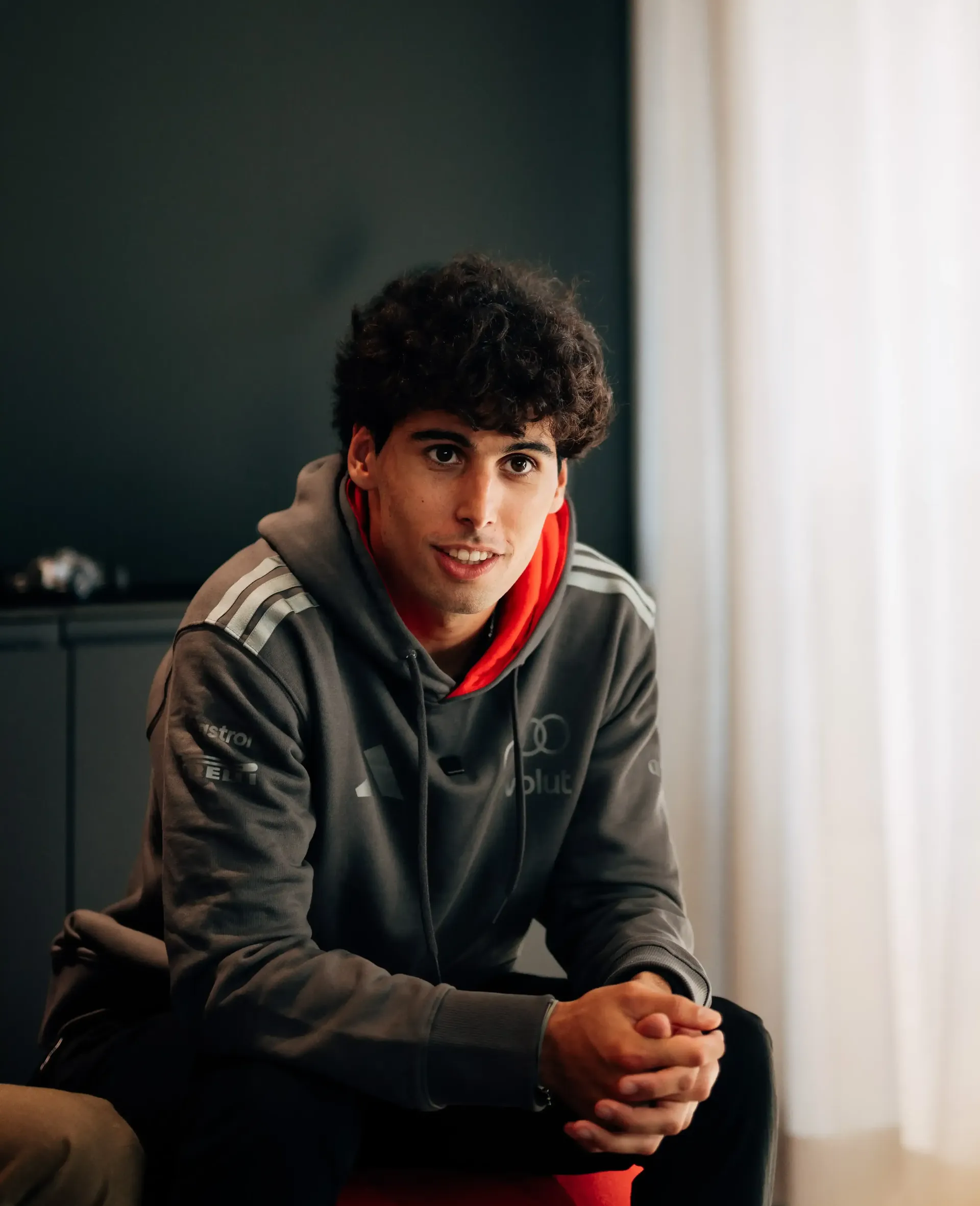 Gabriel Bortoleto driver at the Audi Revolut F1® Team inside the hospitality Audi Hub giving an interview in realxed pose