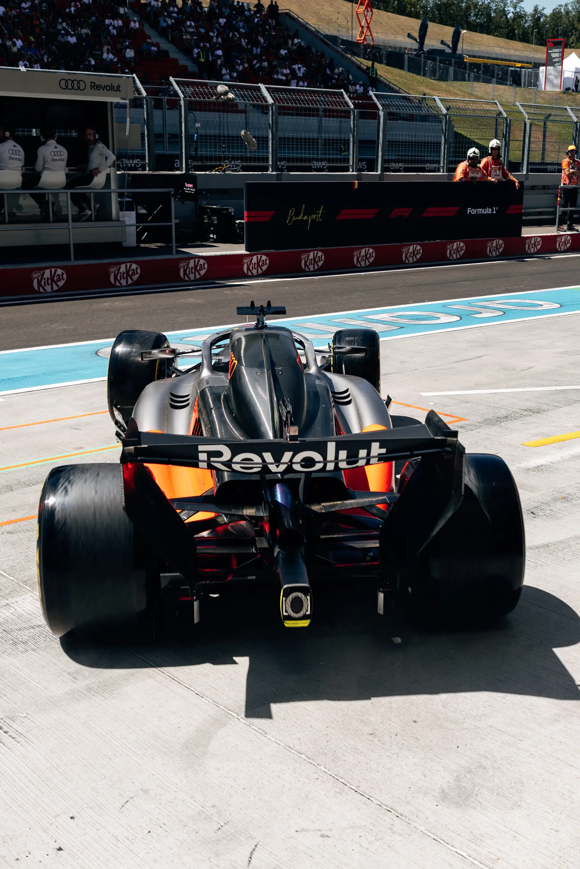 Rear view of the Audi Revolut F1® Team Audi R26 exiting the pit lane during FP3 at the Hungaroring.