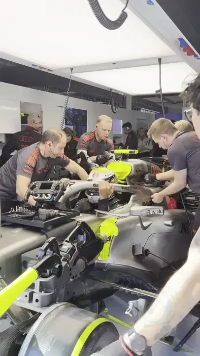 Audi Revolut F1® Team driver jump out the cockpit at the Hungarian GP 2026 inside the garage