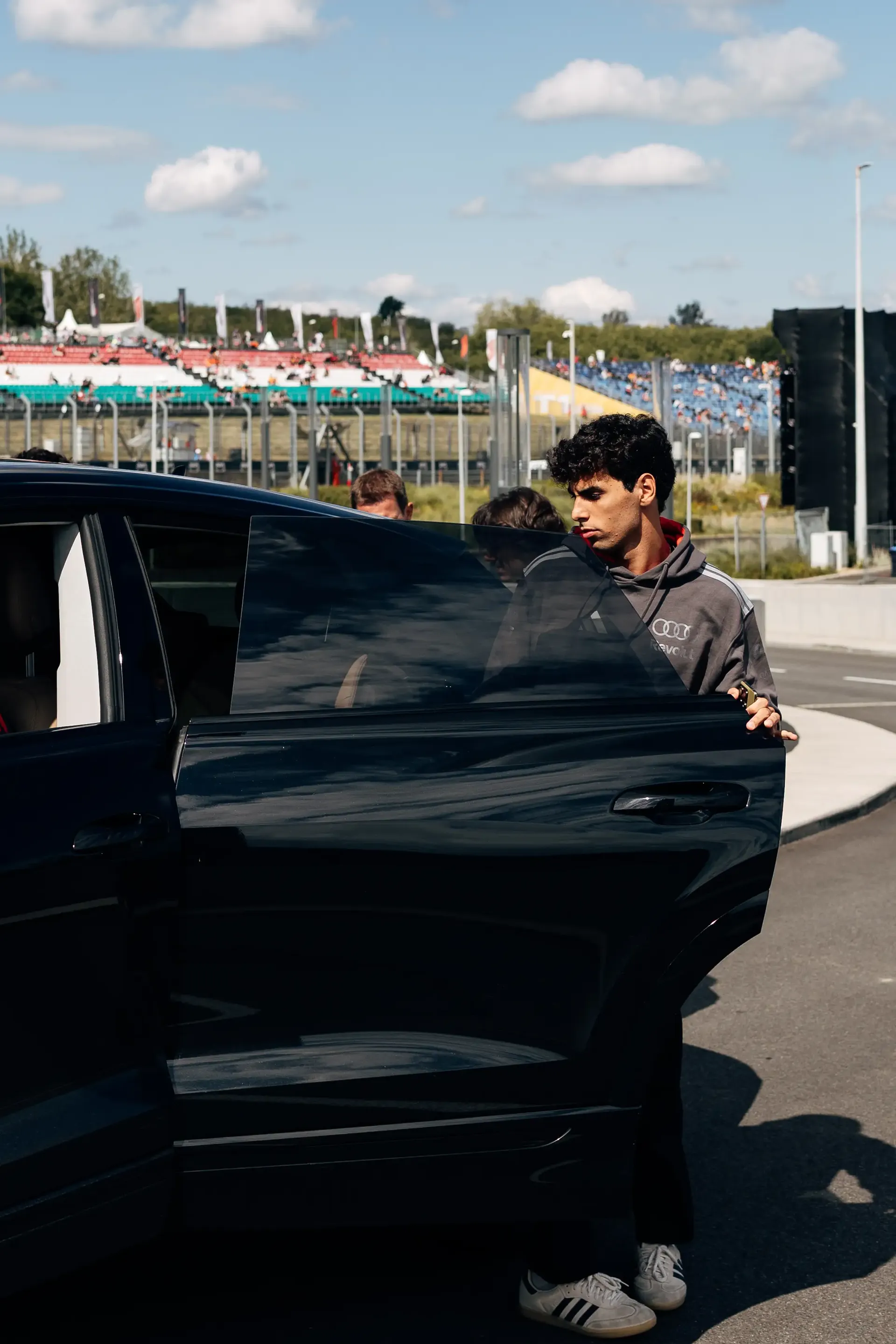 Audi Revolut F1® Team driver Gabriel Bortoleto arrives in the Hungaroring paddock ahead of FP1 at the Hungarian Grand Prix.
