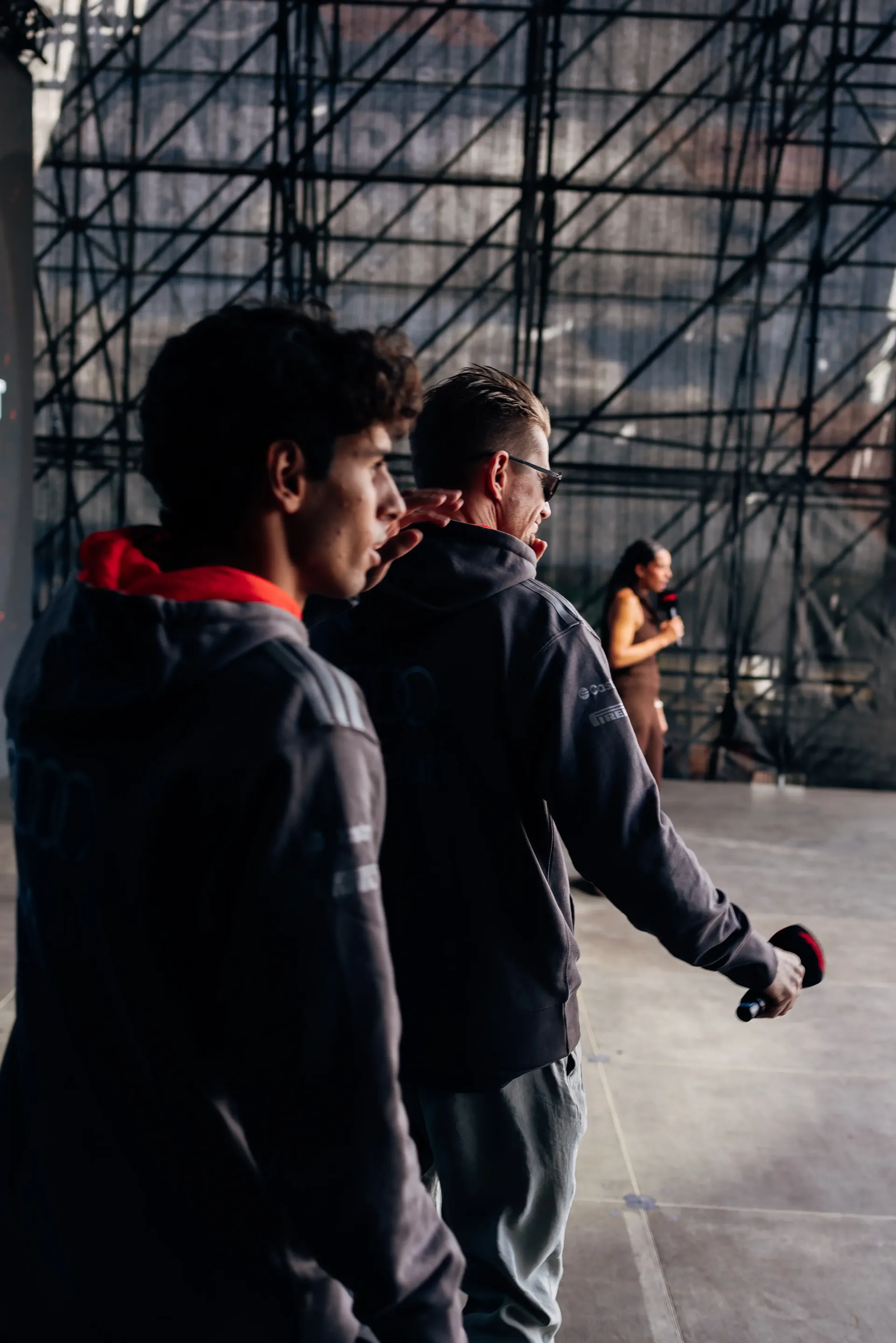Audi Revolut F1® Team drivers Gabriel Bortoleto and Nico Hulkenberg walk backstage at the Formula 1® Fan Forum in Budapest.