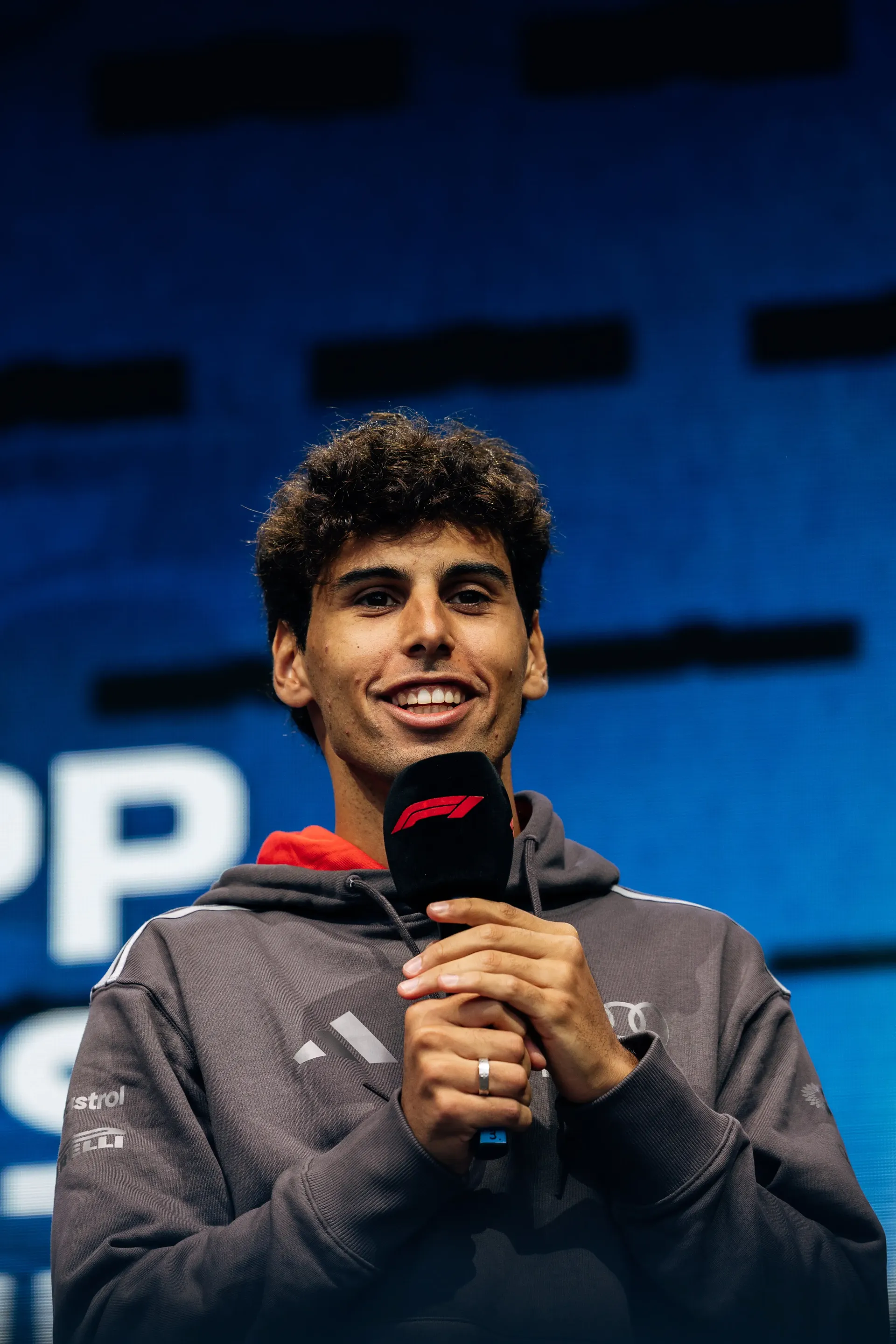 Audi Revolut F1® Team driver Gabriel Bortoleto speaks on stage at the Formula 1® Fan Forum in Budapest.