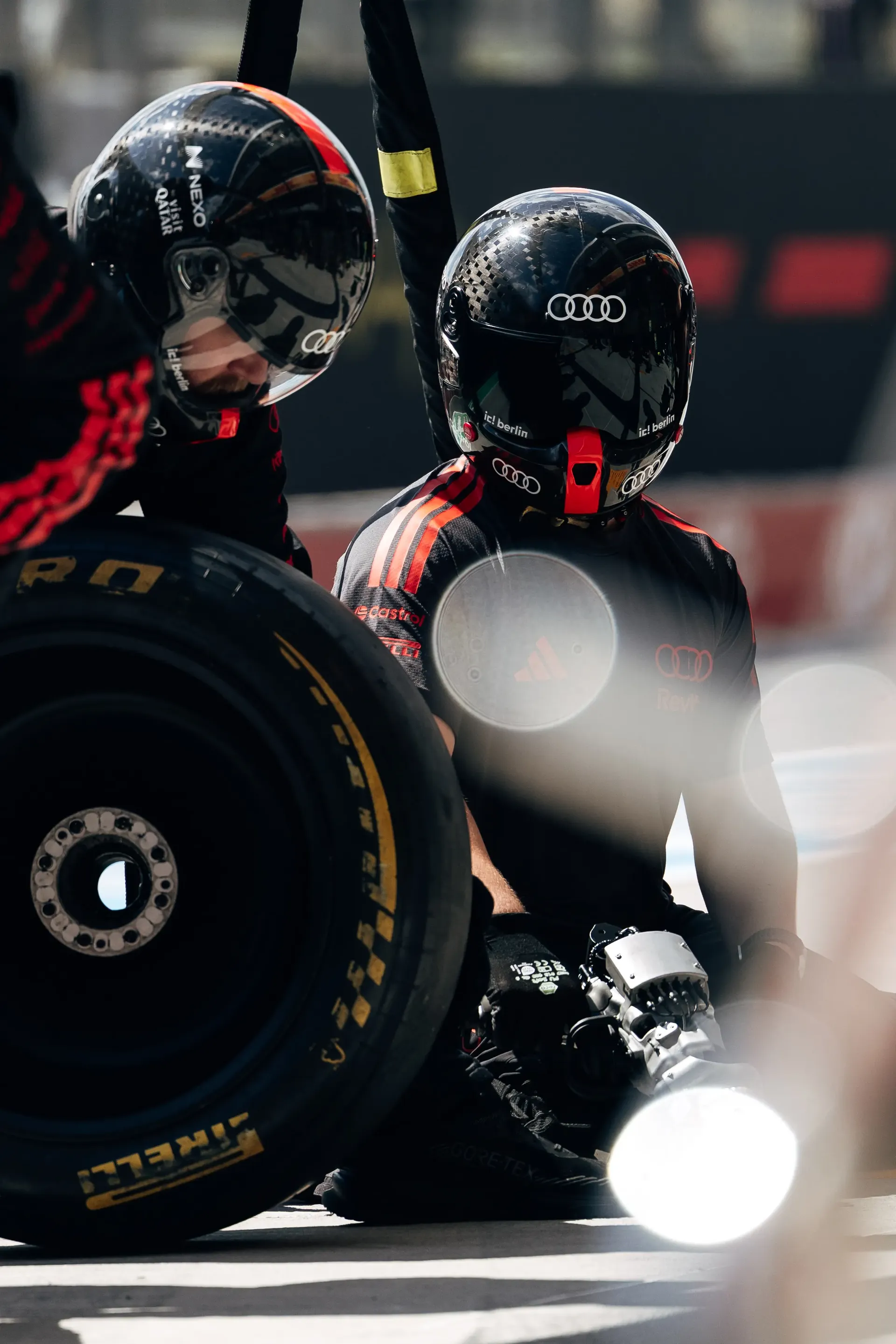 Audi Revolut F1® Team mechanics complete a pit stop practice during FP1 at the Hungarian Grand Prix.