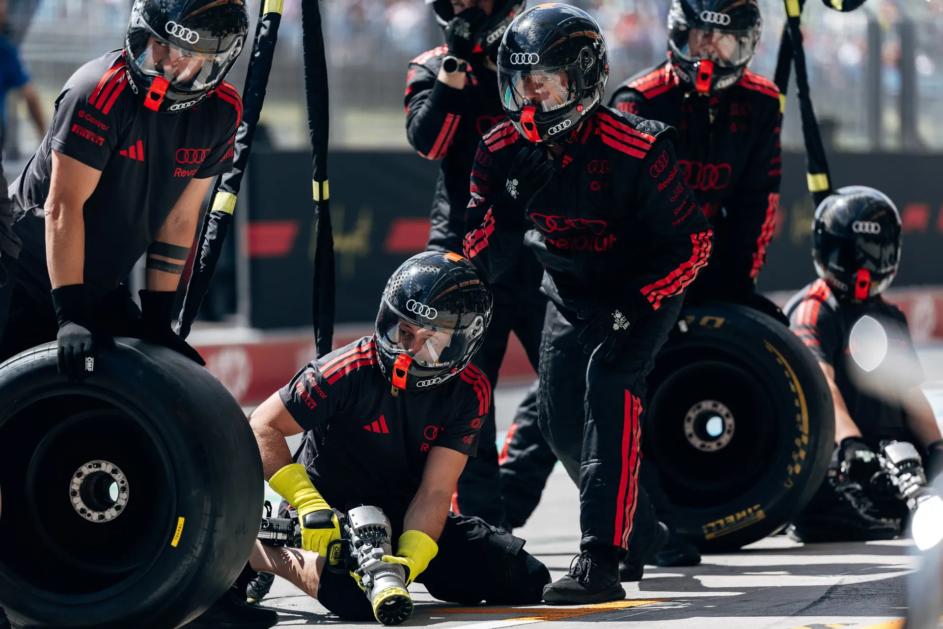 Audi Revolut F1® Team pit crew rehearses a pit stop during Friday practice at the Hungaroring.