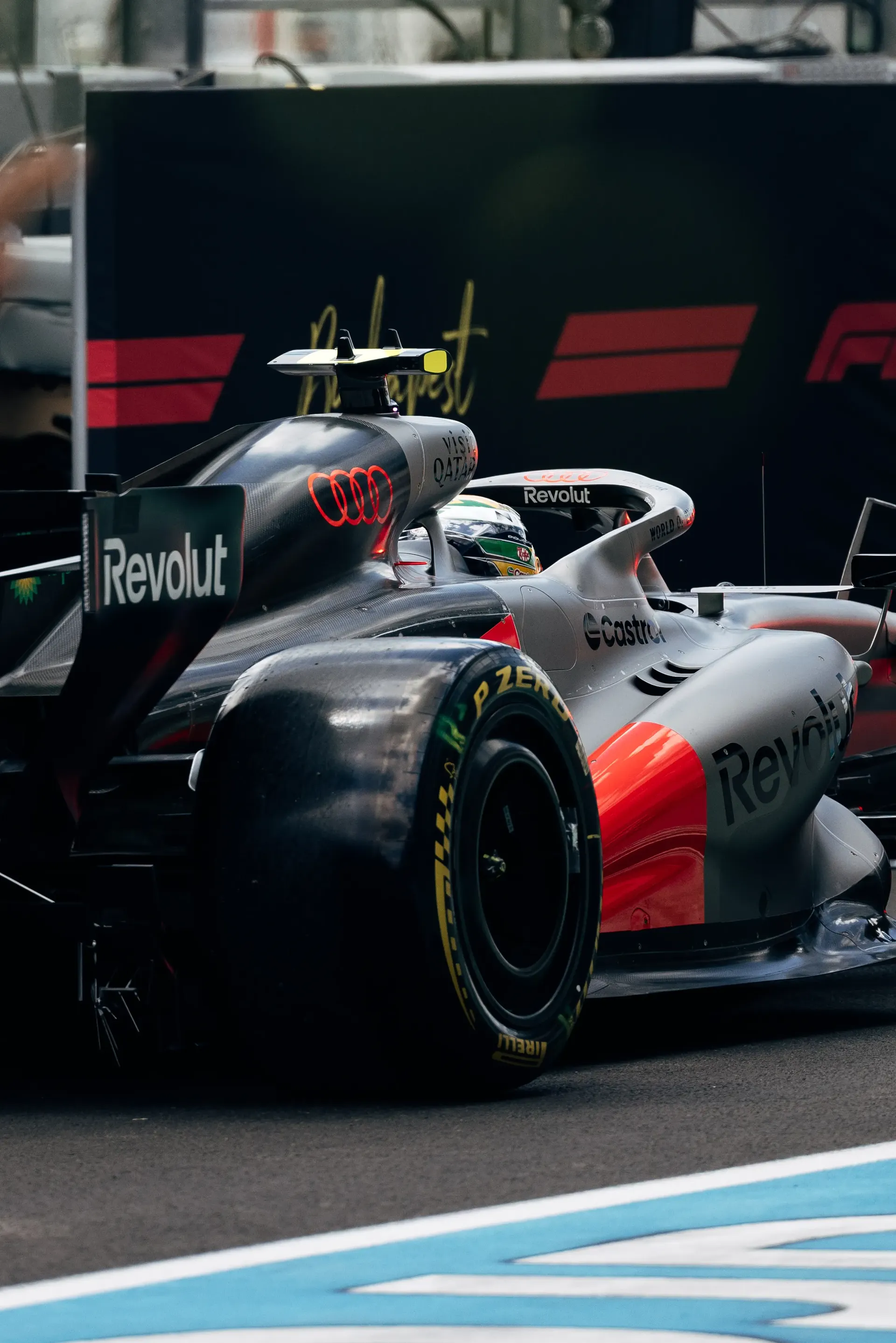 Rear three-quarter view of the Audi R26 in the Hungaroring pit lane during FP1.