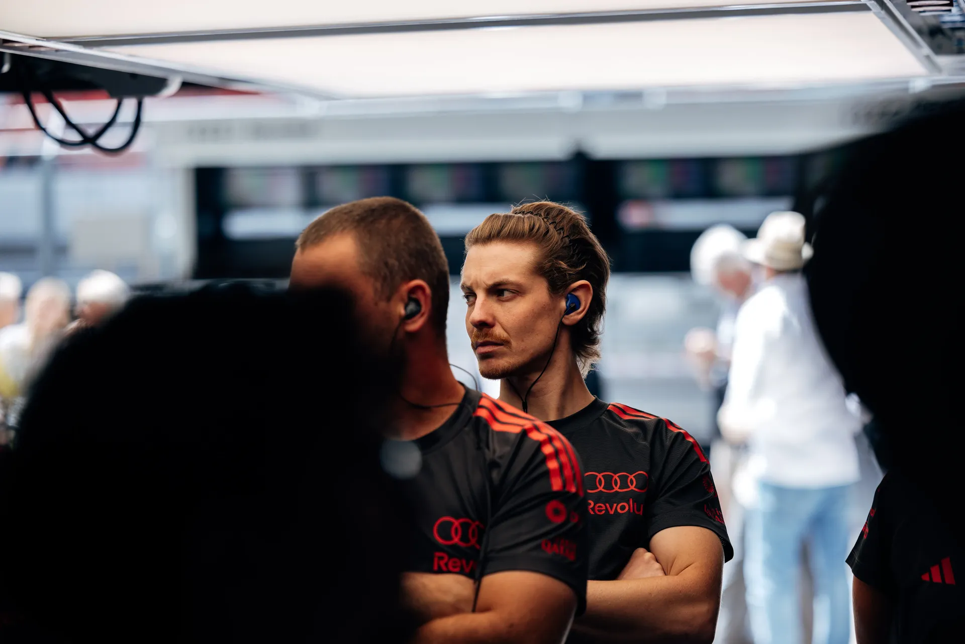 Audi Revolut F1® Team mechanics discuss performance in the Hungaroring garage.