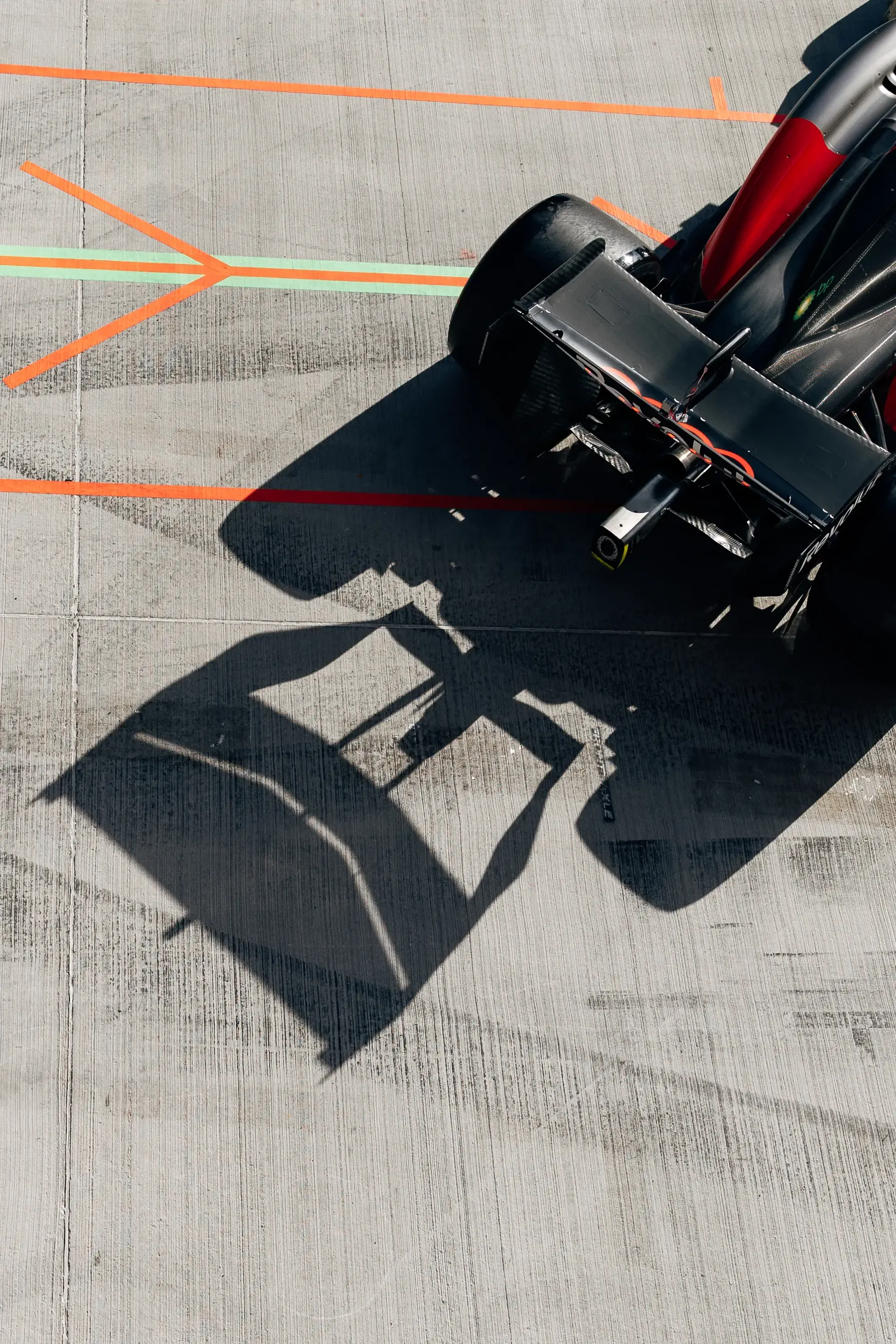 Overhead view of the Audi Revolut F1® Team car Audi R26 casting a shadow in the Hungaroring pit lane during FP2.