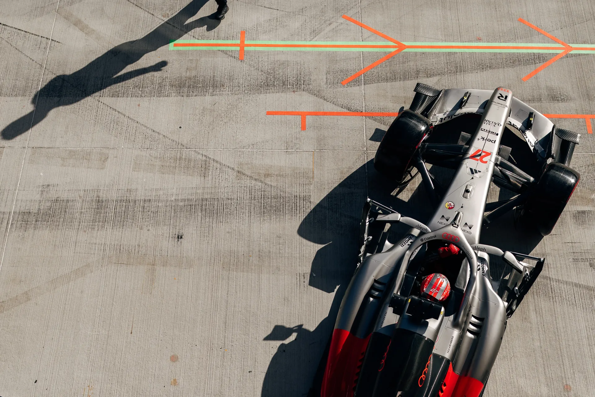 Top-down view of the Audi Revolut F1® Team car Audi R26 exiting the pit box during FP2 at the Hungaroring.