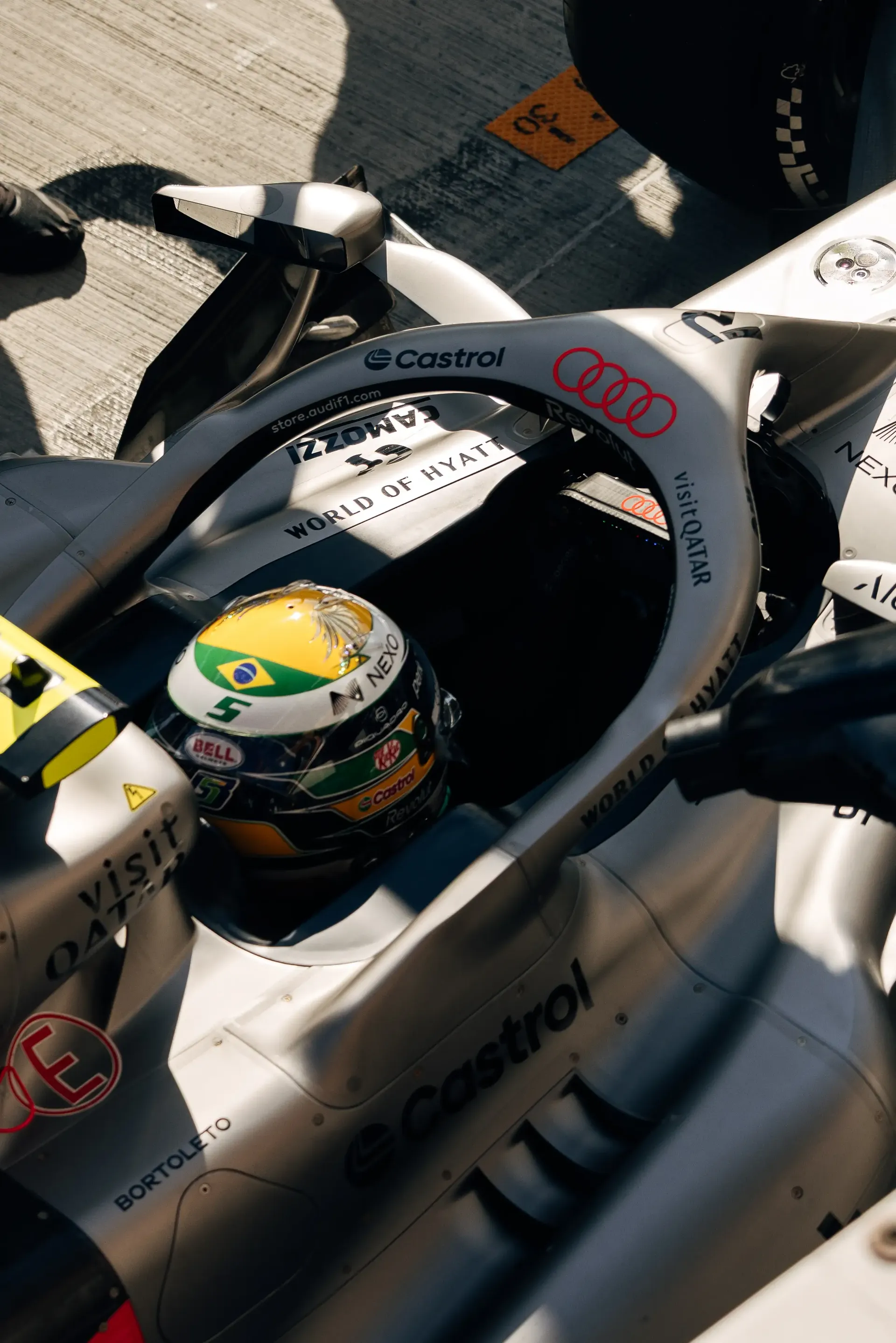 Audi Revolut F1® Team driver Gabriel Bortoleto sits in the cockpit of the Audi Revolut F1® Team car Audi R26 during FP2 at the Hungaroring.