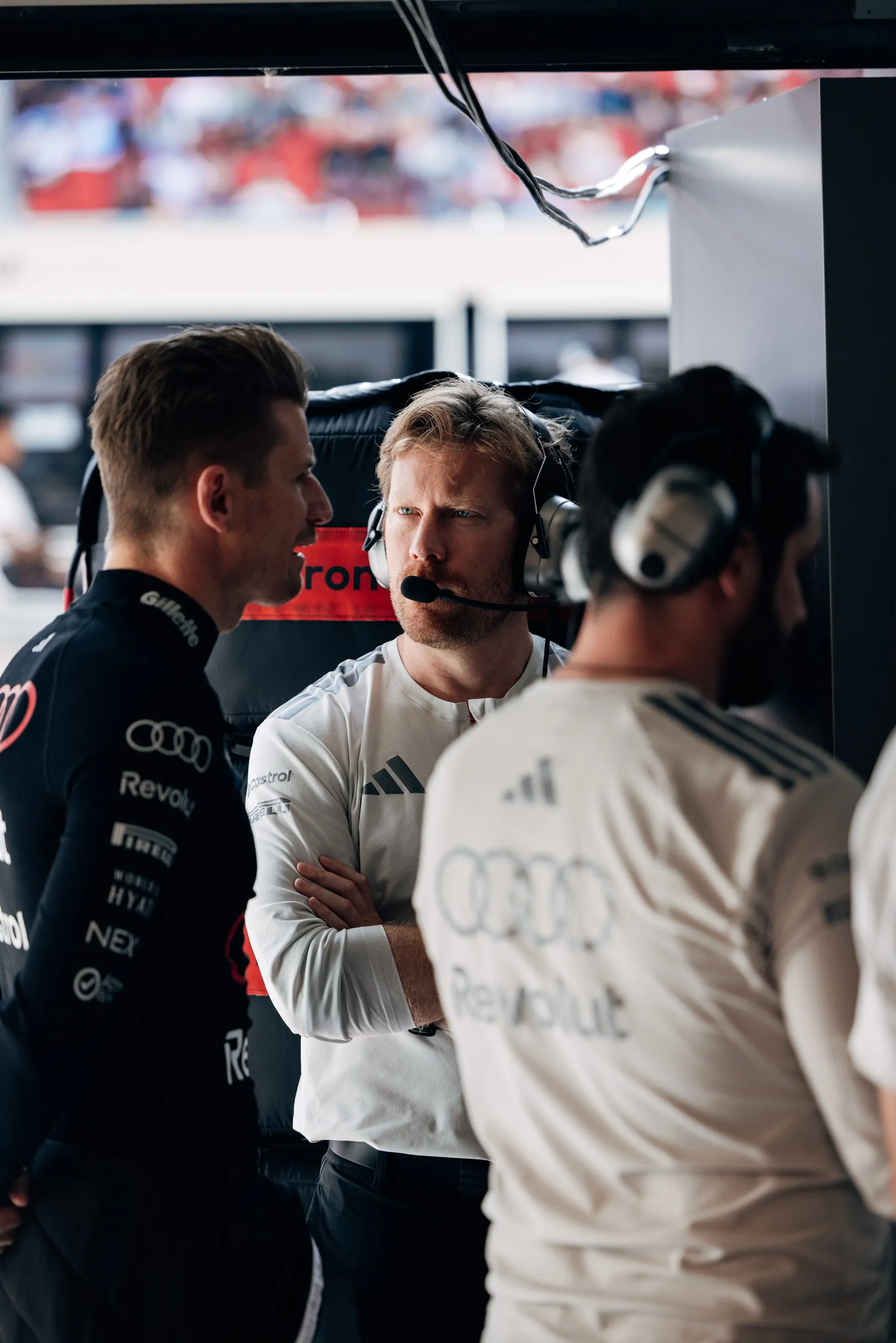 Audi Revolut F1® Team driver Nico Hulkenberg and engineers discuss performance data inside the team garage during FP2 at the Hungaroring.