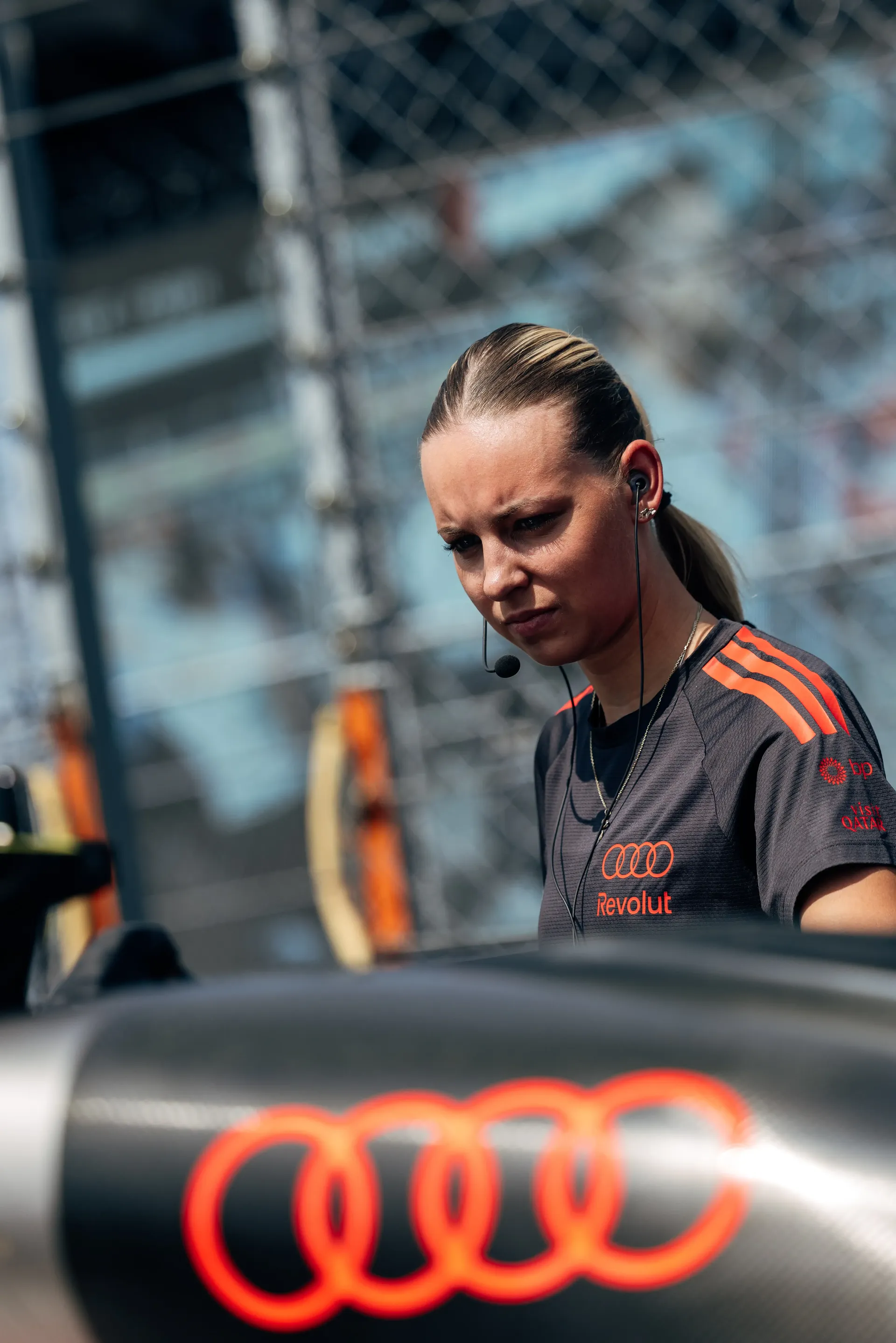 An Audi Revolut F1® Team mechanic stands beside the Audi R26 during final pre-race preparations at the Hungaroring.