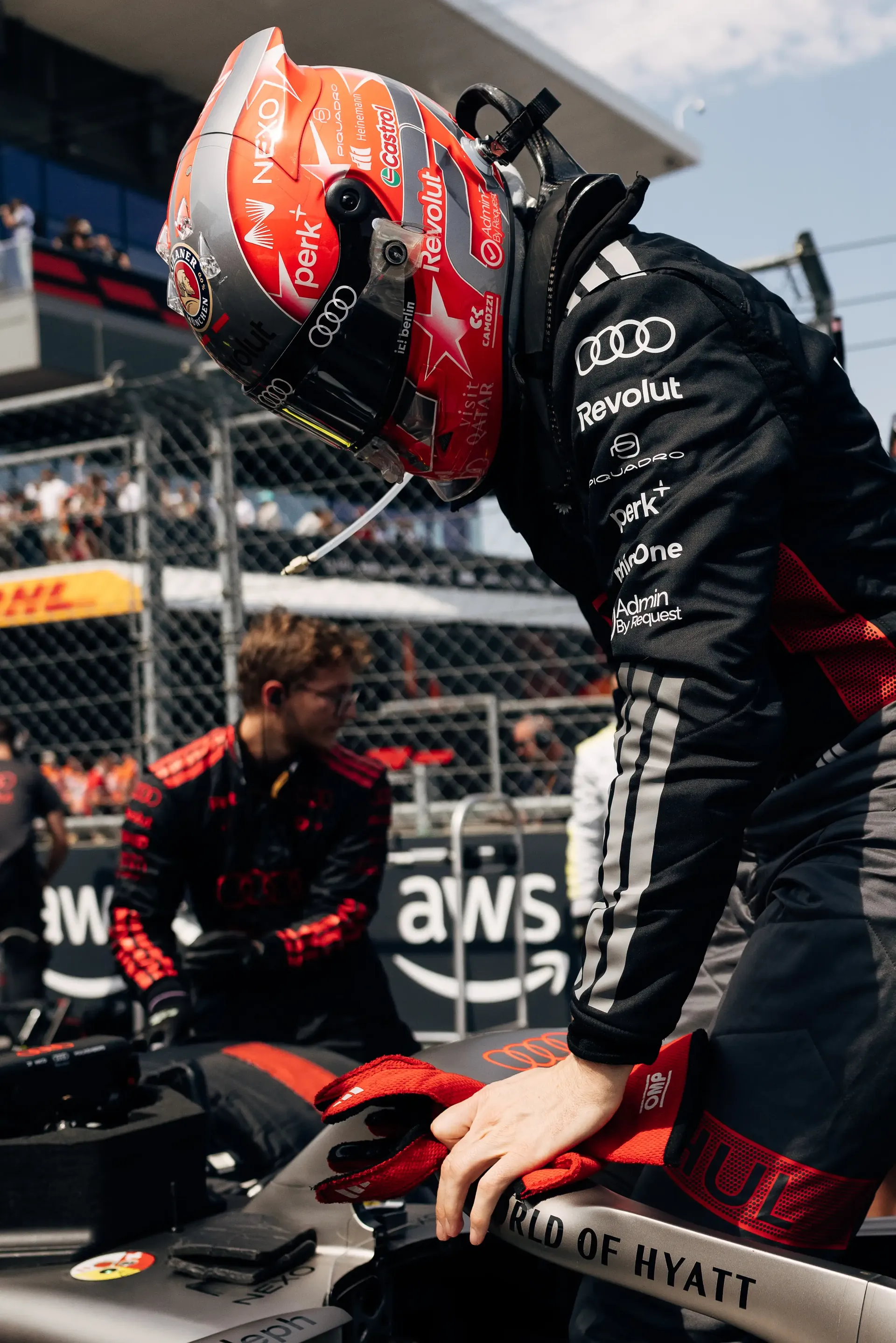 Audi Revolut F1® Team driver Gabriel Bortoleto climbs into the Audi R26 on the Hungaroring grid before the race.