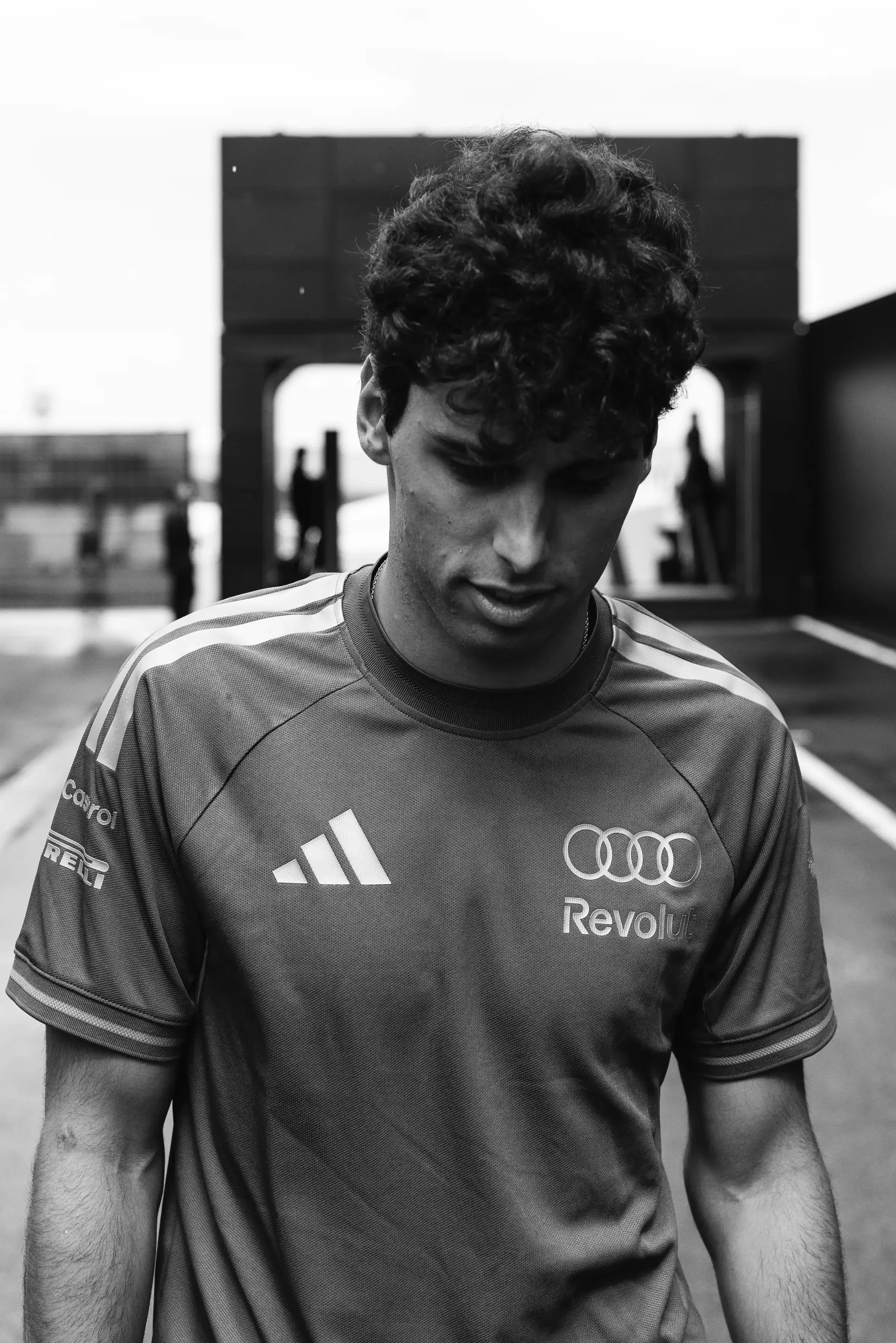 Black-and-white portrait of Audi Revolut F1® Team driver Gabriel Bortoleto arriving at the Hungaroring.