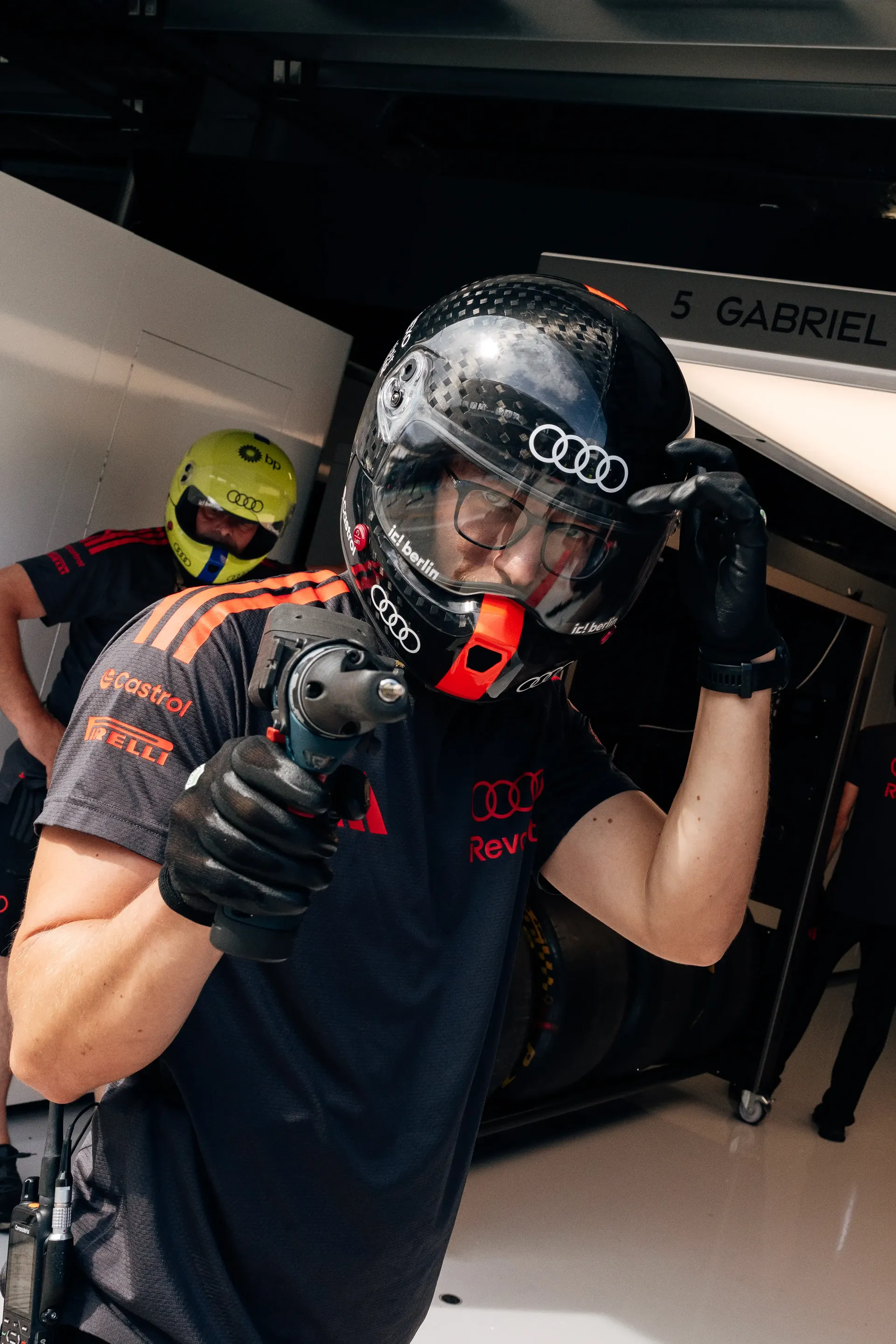Audi Revolut F1® Team mechanic prepares for driver installation ahead of FP1 at the Hungaroring.
