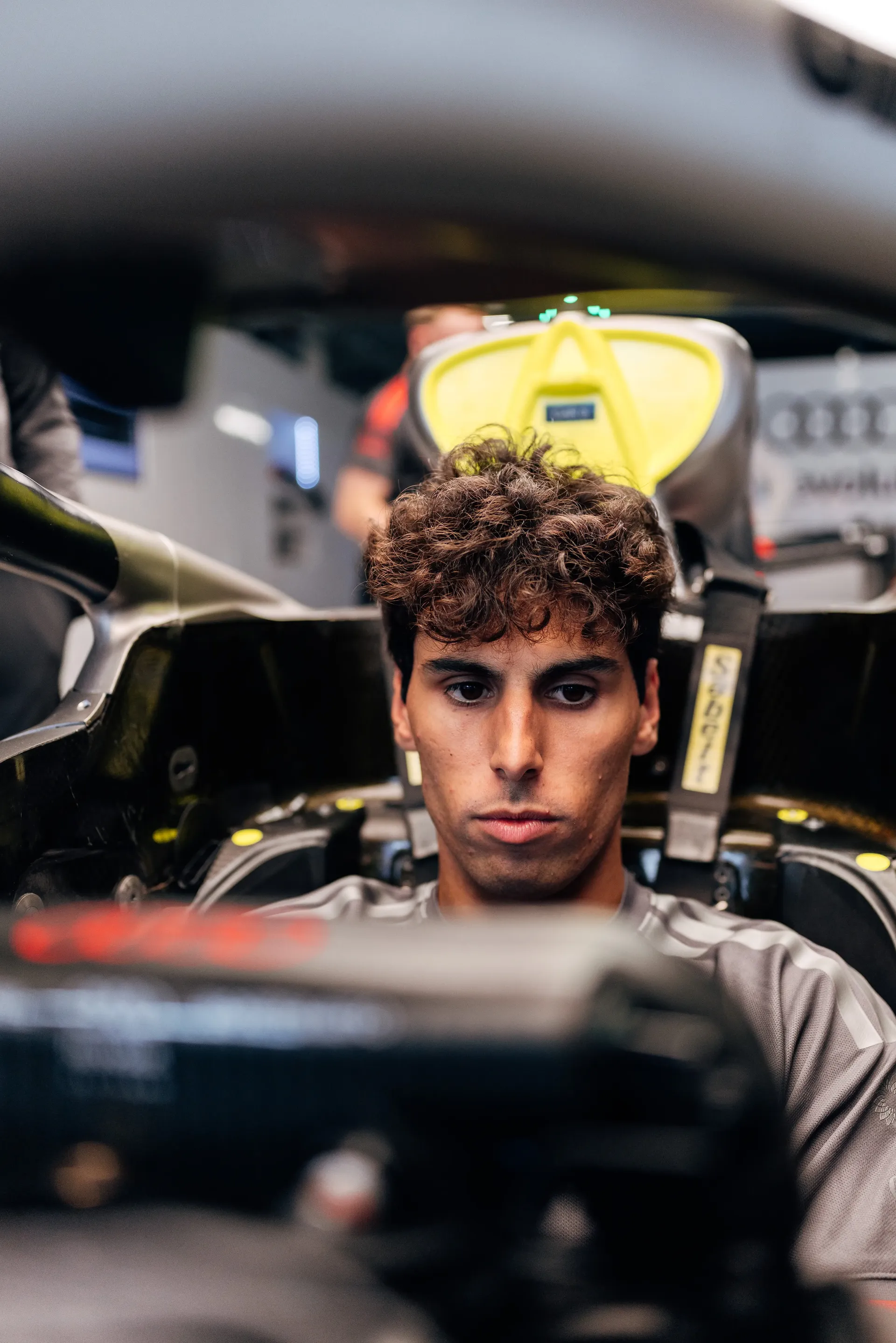 Audi Revolut F1® Team driver Gabriel Bortoleto sits in the Audi R26 garage during driver installation ahead of FP1 at the Hungaroring.