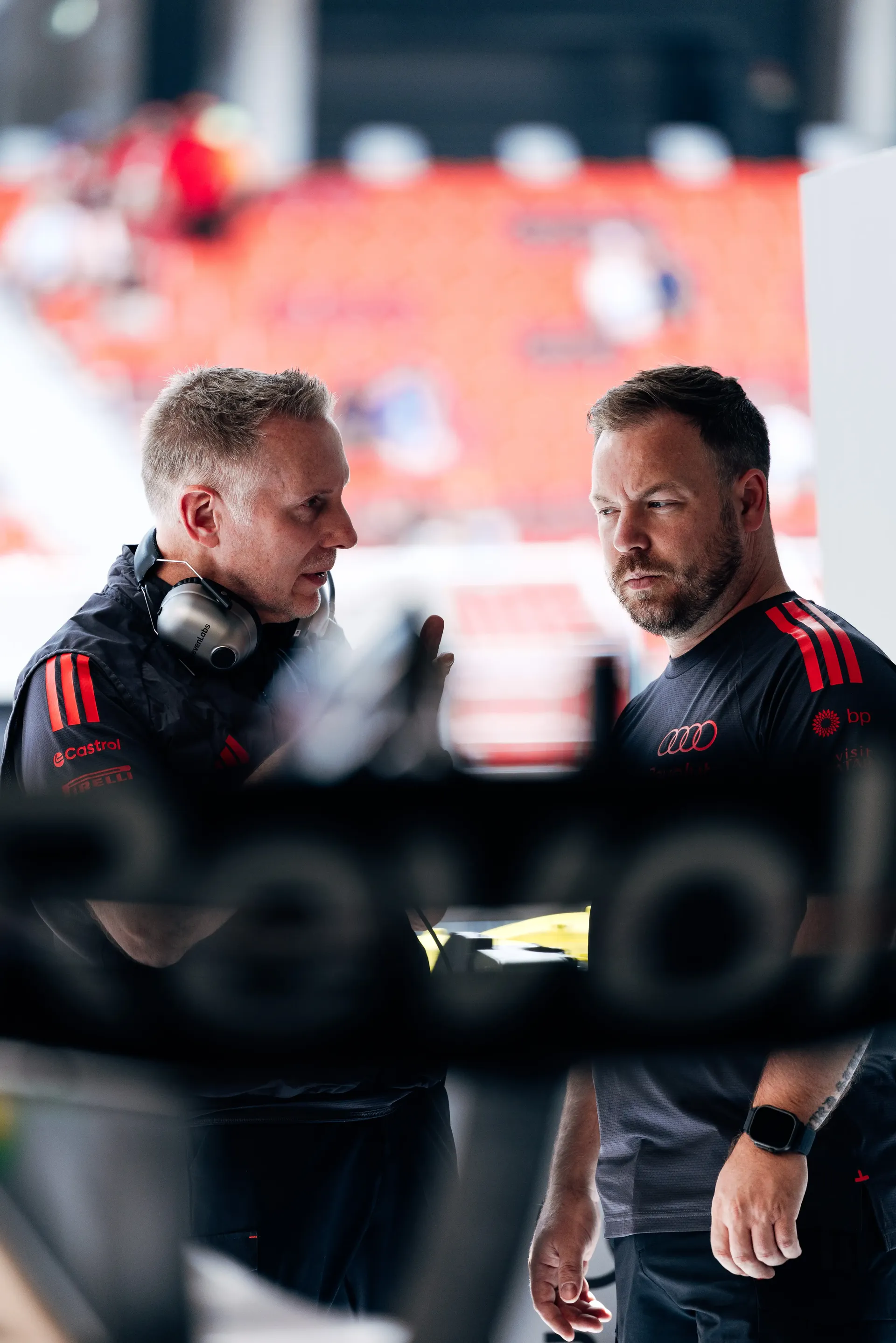 Audi Revolut F1® Team personnel talk inside the Hungaroring paddock on Thursday.