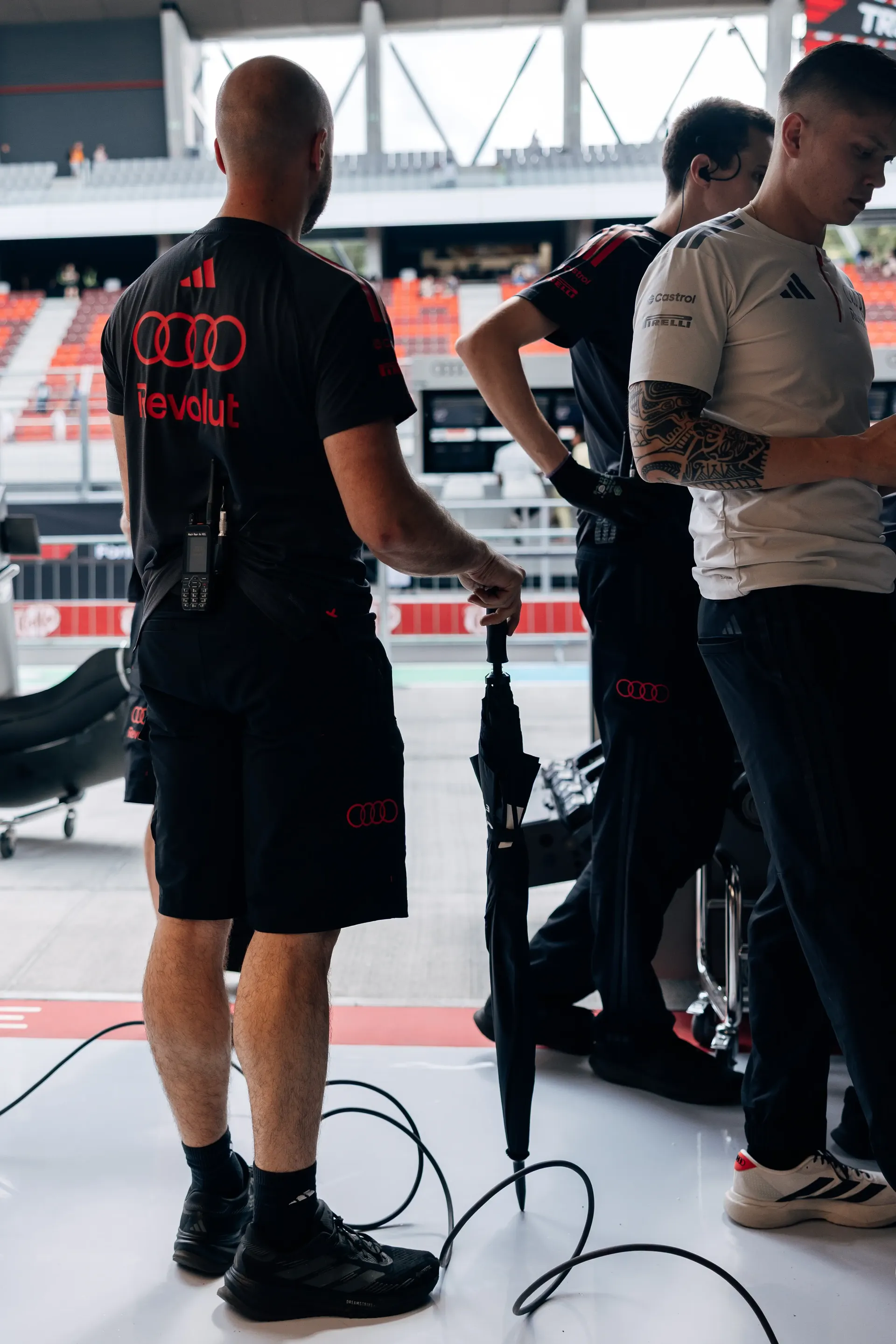Audi Revolut F1® Team members work around the Audi R26 in the Hungaroring garage.