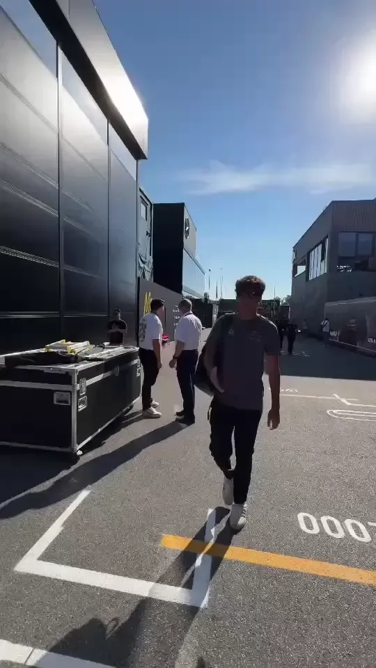 Audi Revolut F1® Team driver Gabriel Bortoleto walks through the paddock during Thursday arrivals ahead of the Italian Grand Prix.