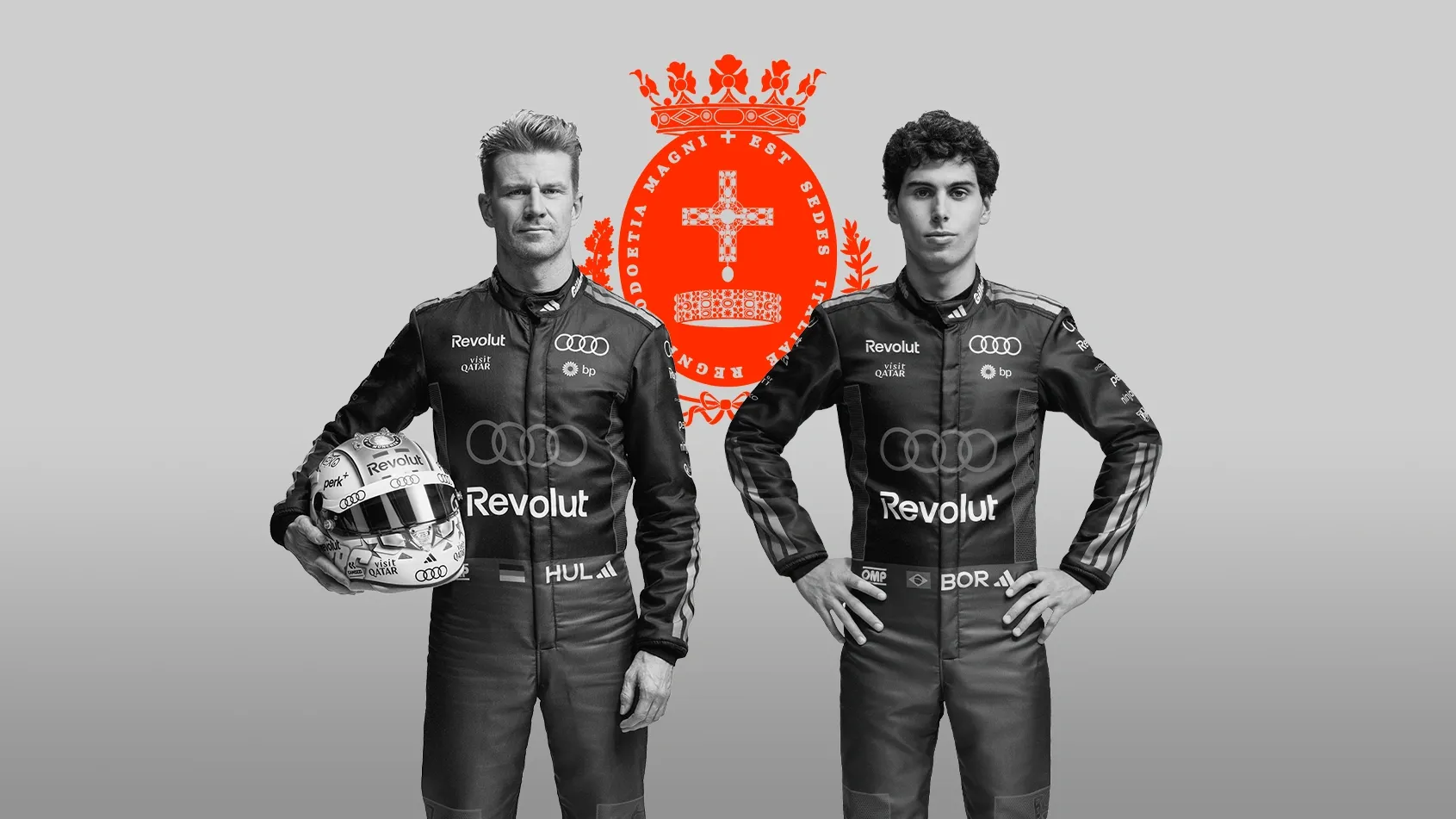 Black and white front shot of Audi Revolut F1® Team driver Nico Hulkenberg and Gabriel Bortoleto posing in front of the Monza sigil in the studio