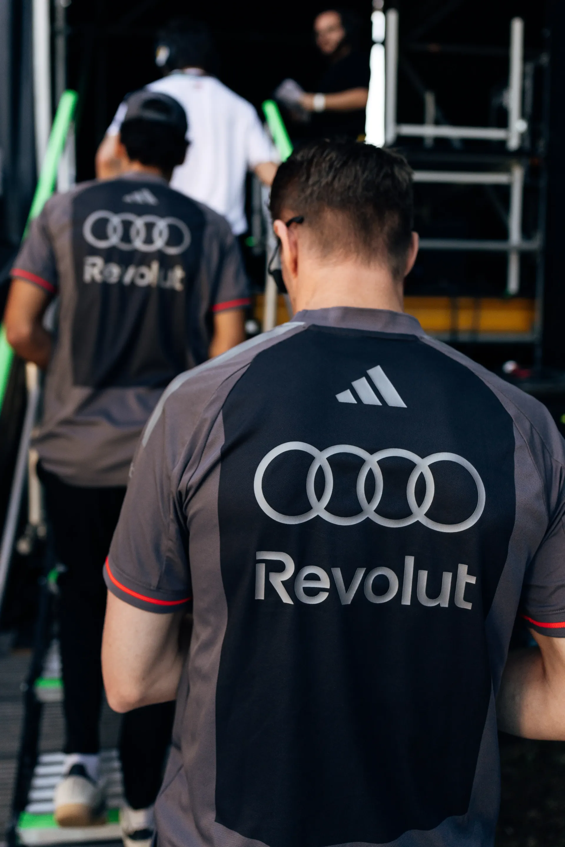 Audi Revolut F1® Team mechanic walking through the paddock at Monza