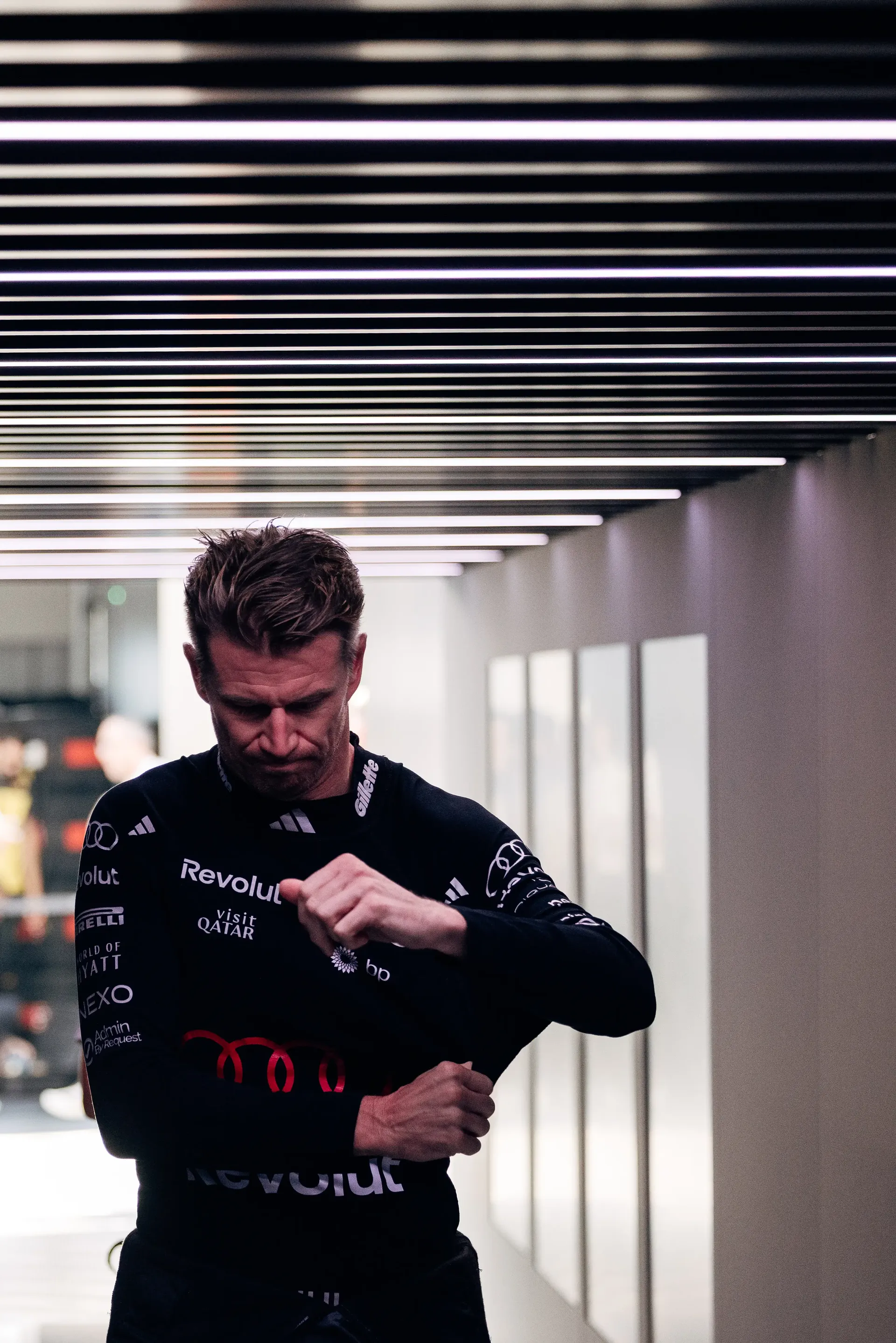 Audi Revolut F1® Team driver Nico Hulkenberg adjusting his race suit