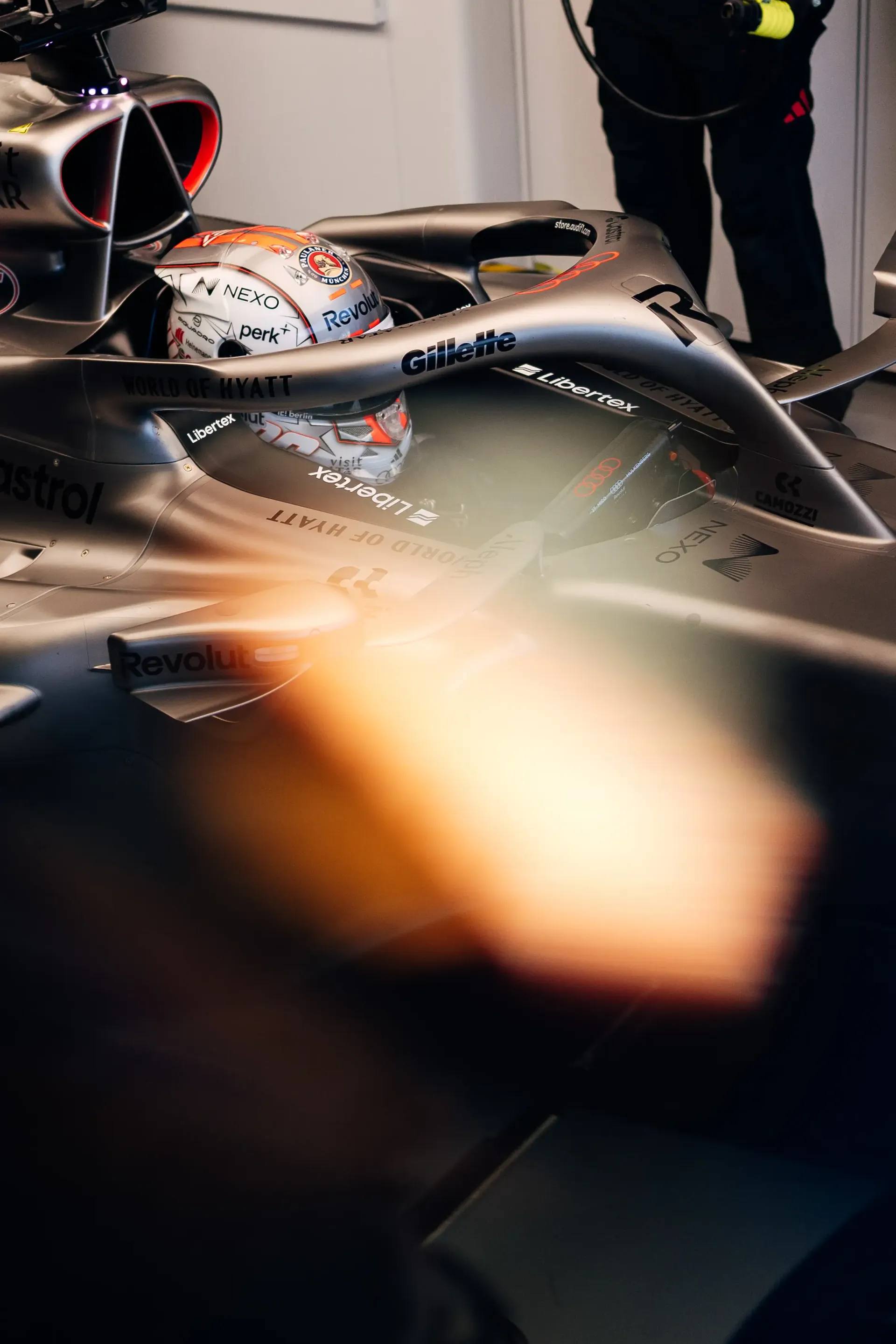 Close-up of Audi Revolut F1® Team driver Nico Hulkenberg inside the Audi R26 in the garage