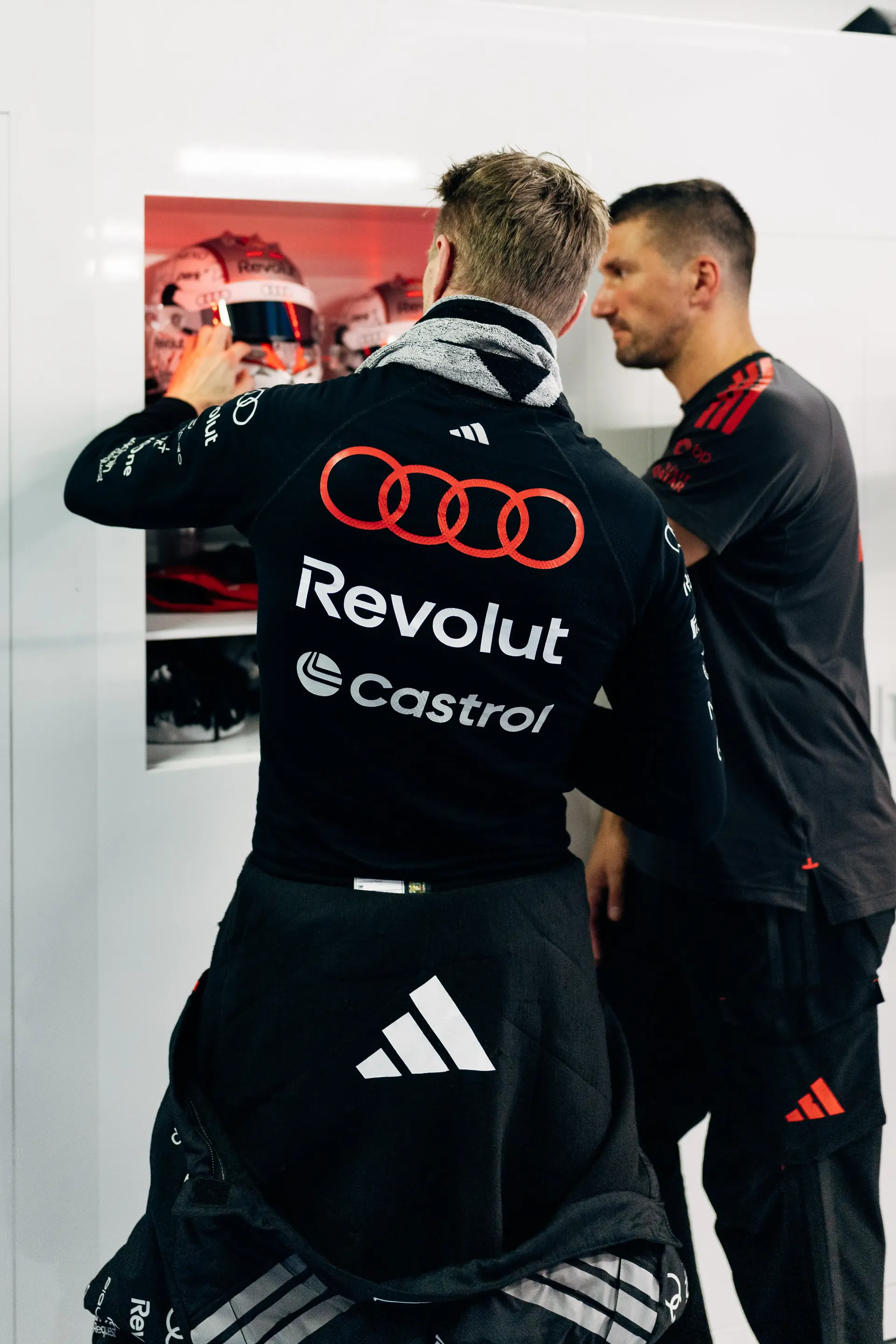 Audi Revolut F1® Team driver Nico Hulkenberg with team mechanics in the garage